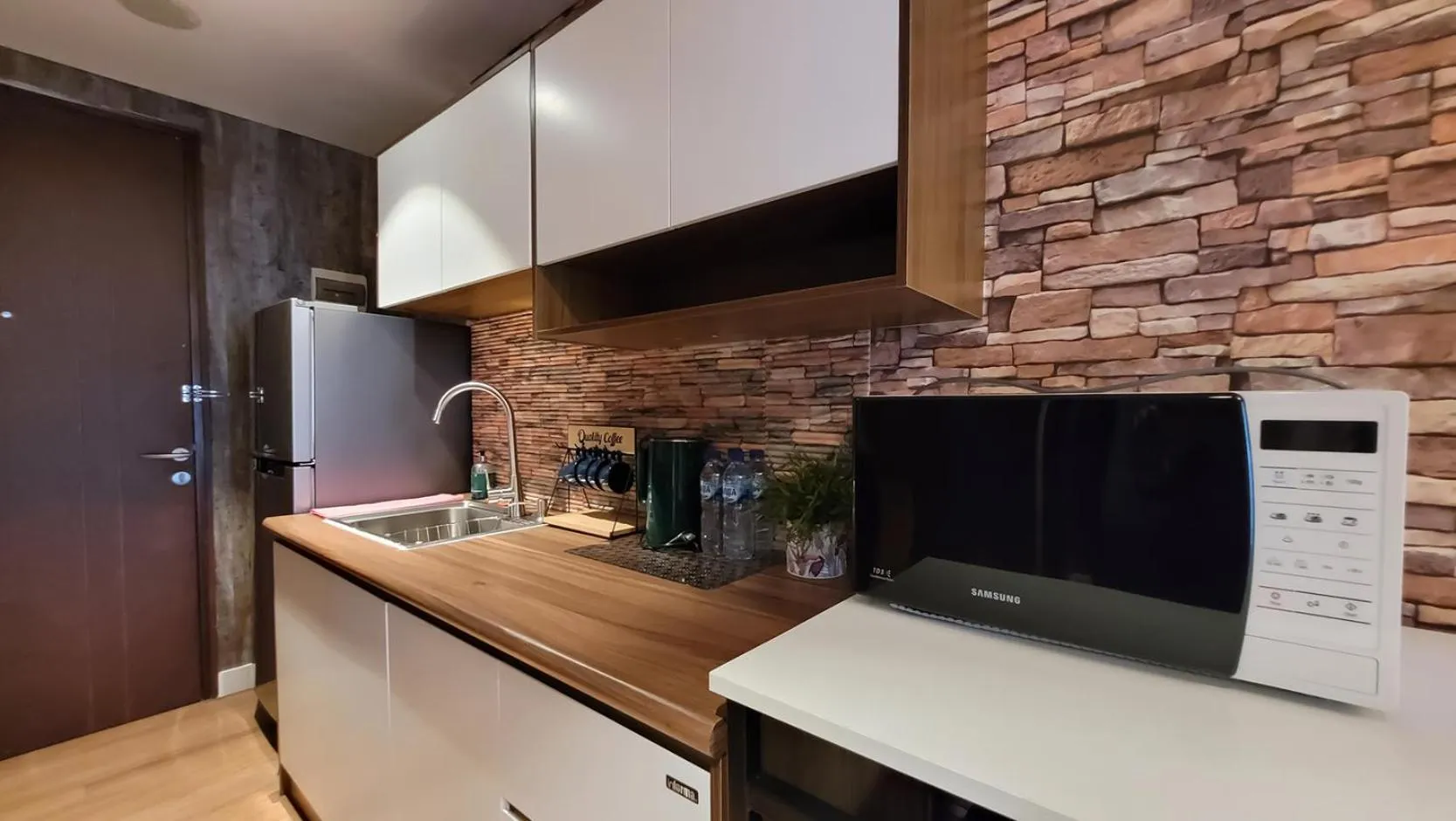 Kitchen or kitchenette in Palam Mansion at Meisterstadt Pollux Habibie Apartment