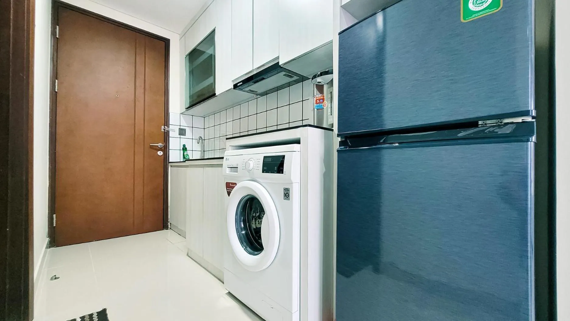 Kitchen or kitchenette in Palam Mansion at Meisterstadt Pollux Habibie Apartment