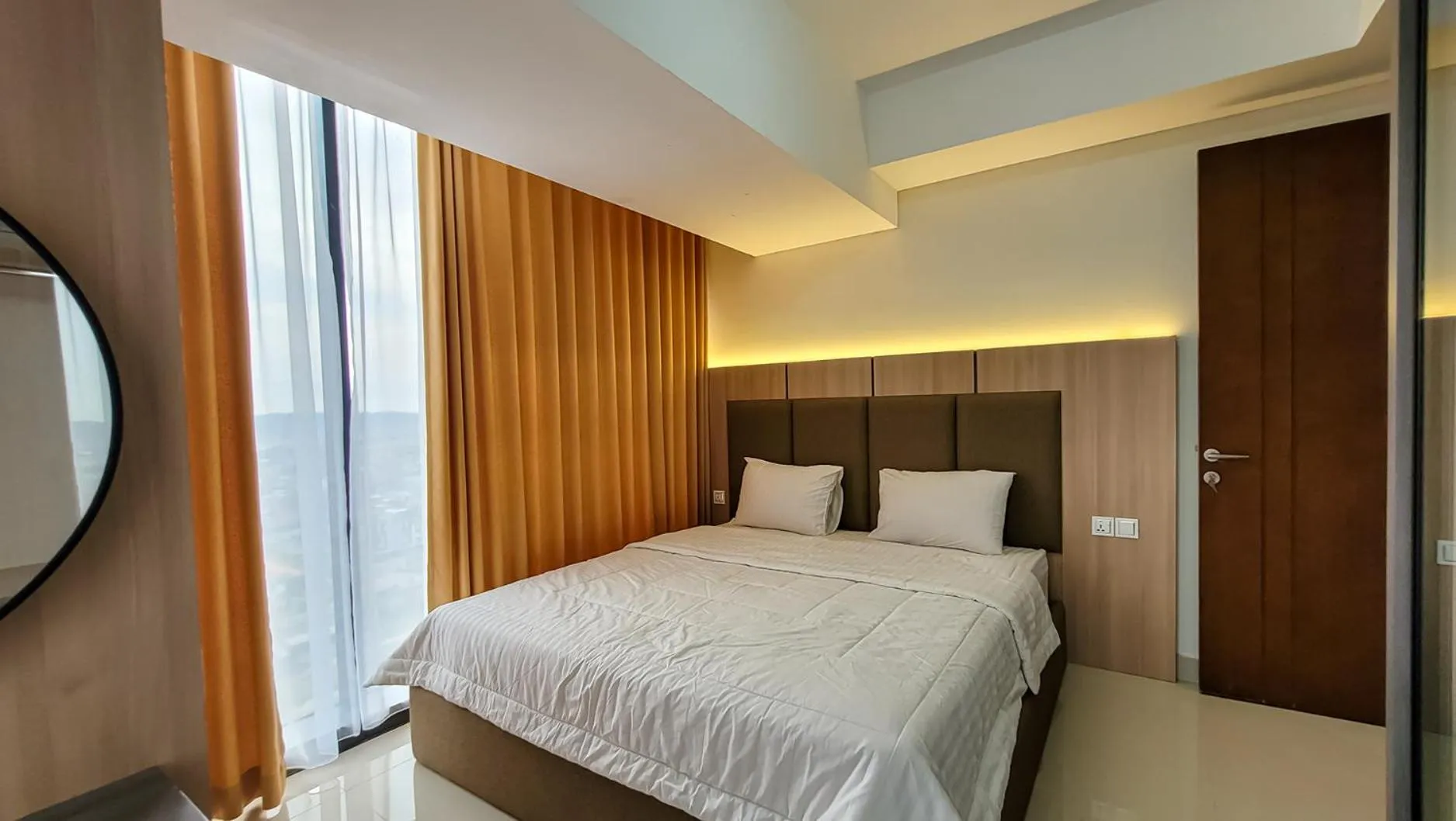 Bed in Palam Mansion at Meisterstadt Pollux Habibie Apartment