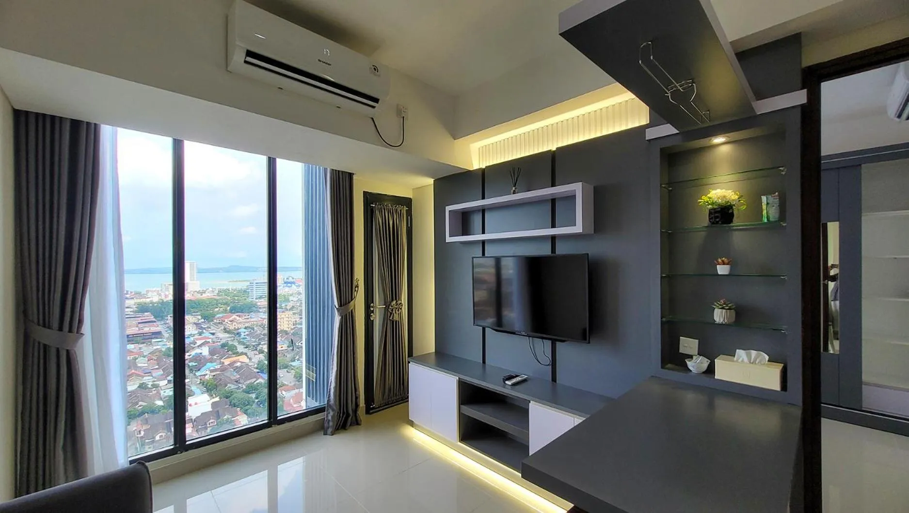 Communal lounge/ TV room in Palam Mansion at Meisterstadt Pollux Habibie Apartment