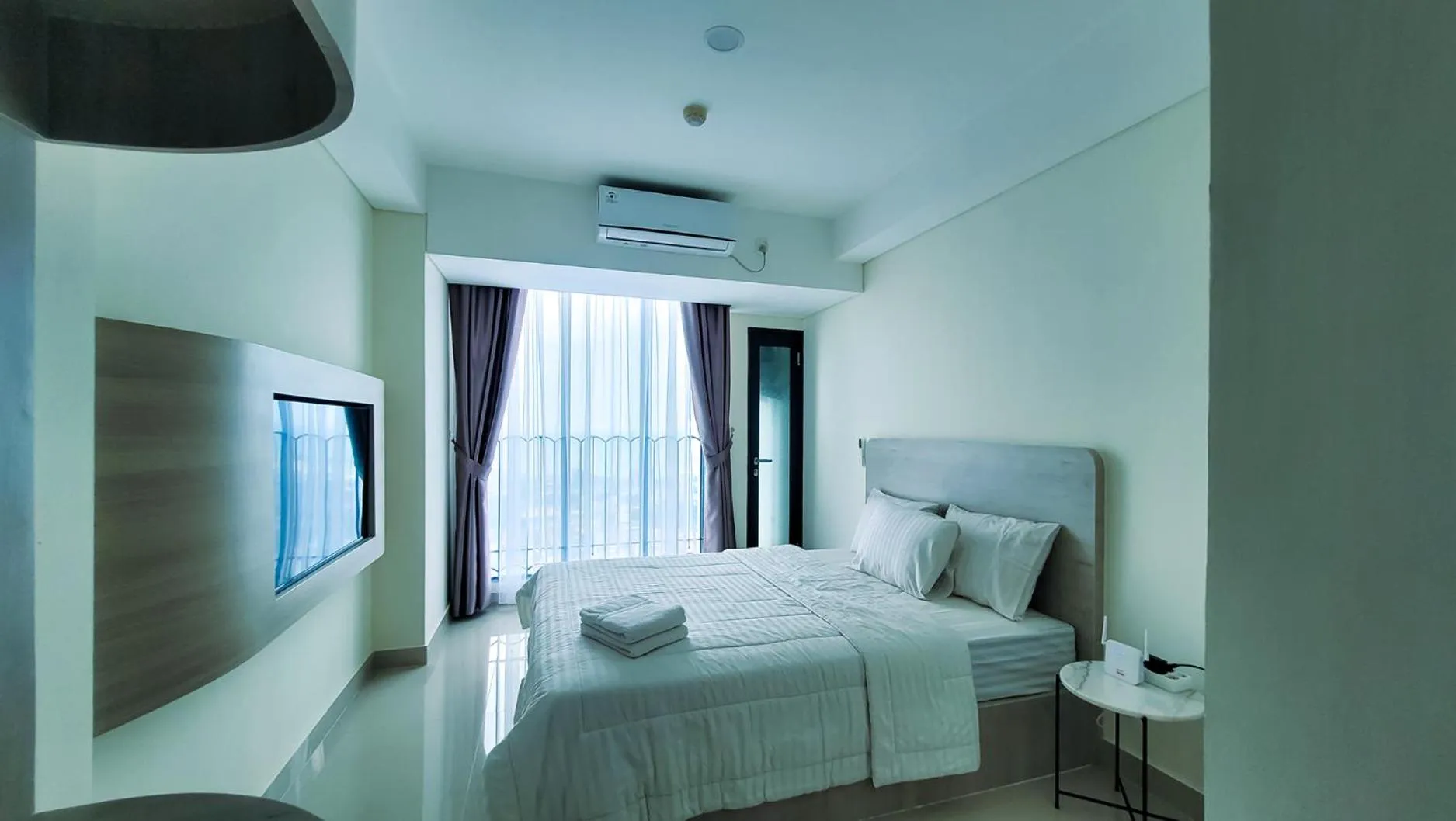 Bed in Palam Mansion at Meisterstadt Pollux Habibie Apartment