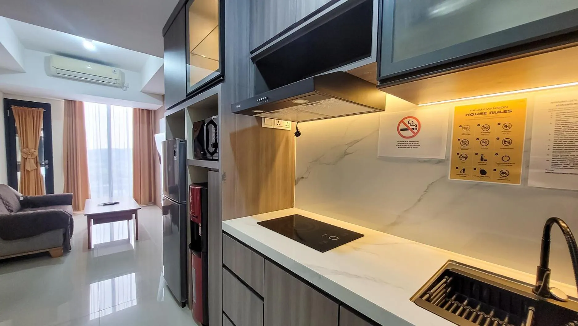 Kitchen or kitchenette in Palam Mansion at Meisterstadt Pollux Habibie Apartment