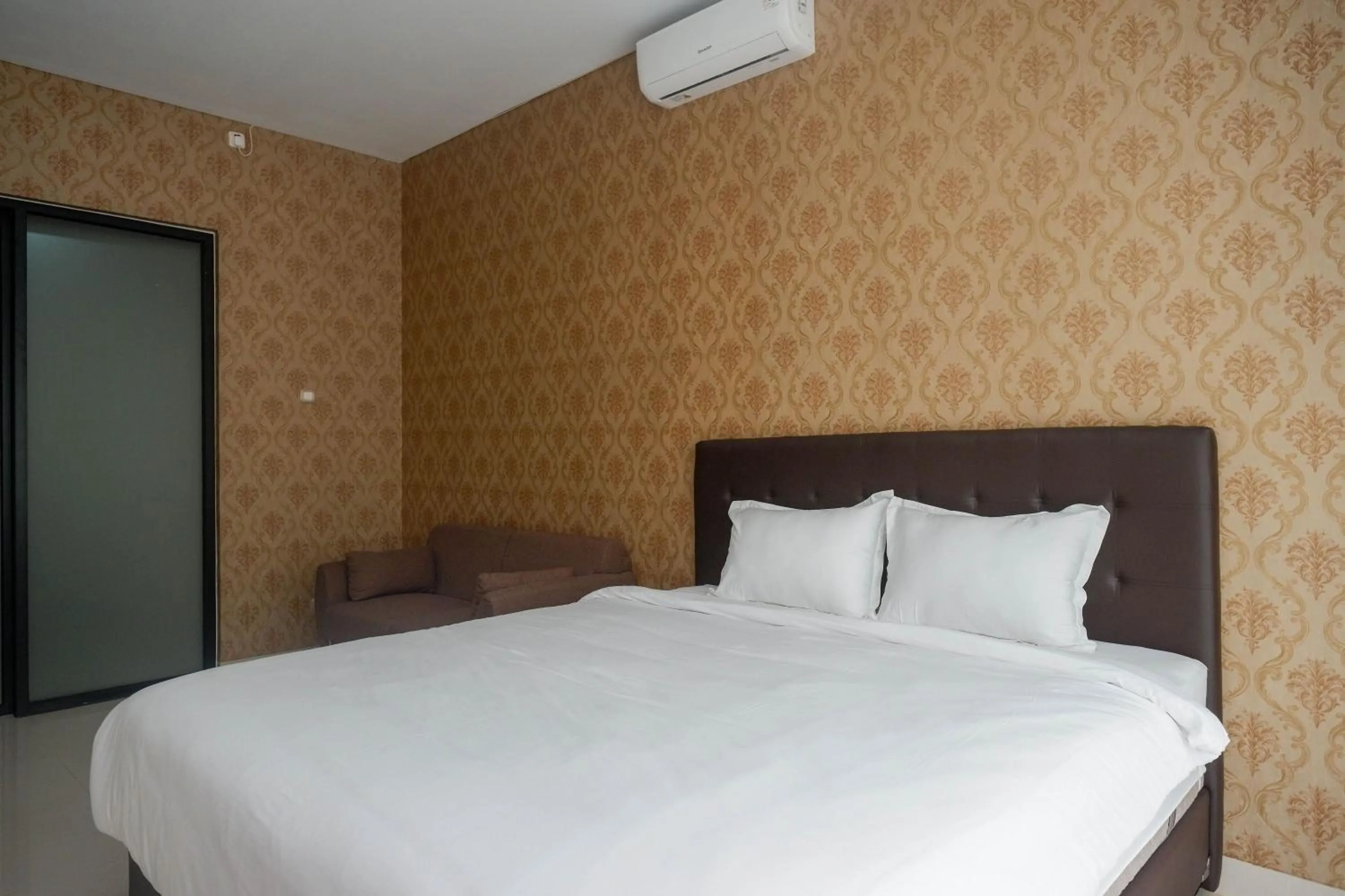 Bedroom, Bed in The Lavana Greenkhaza Villa Jogja