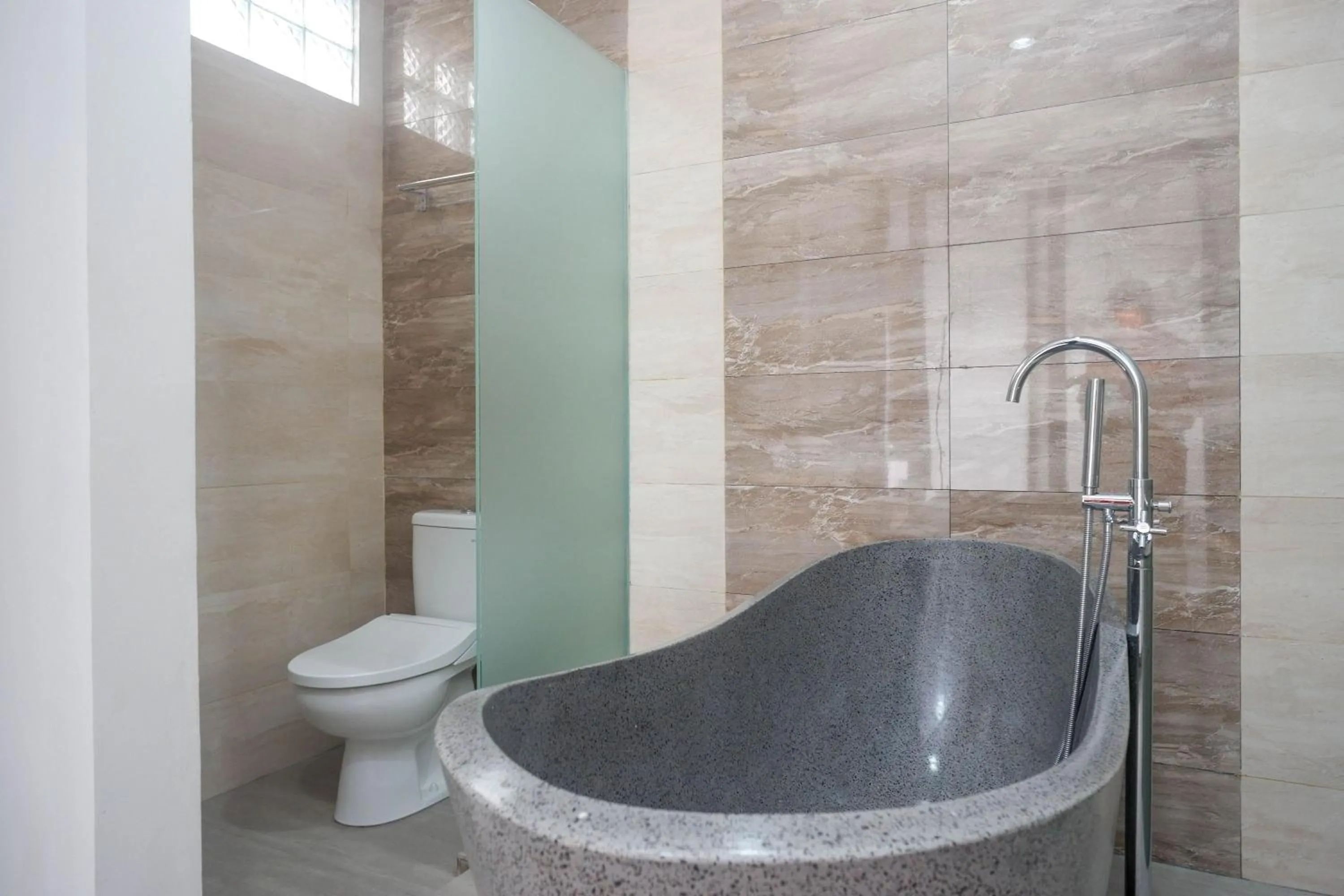 Bathroom in The Lavana Greenkhaza Villa Jogja