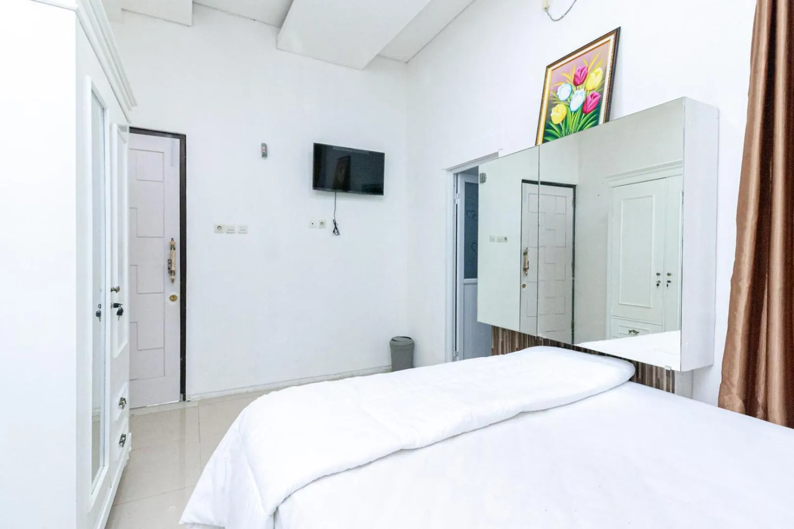 Bedroom, Bed in Urbanview Daniela Jambi by RedDoorz