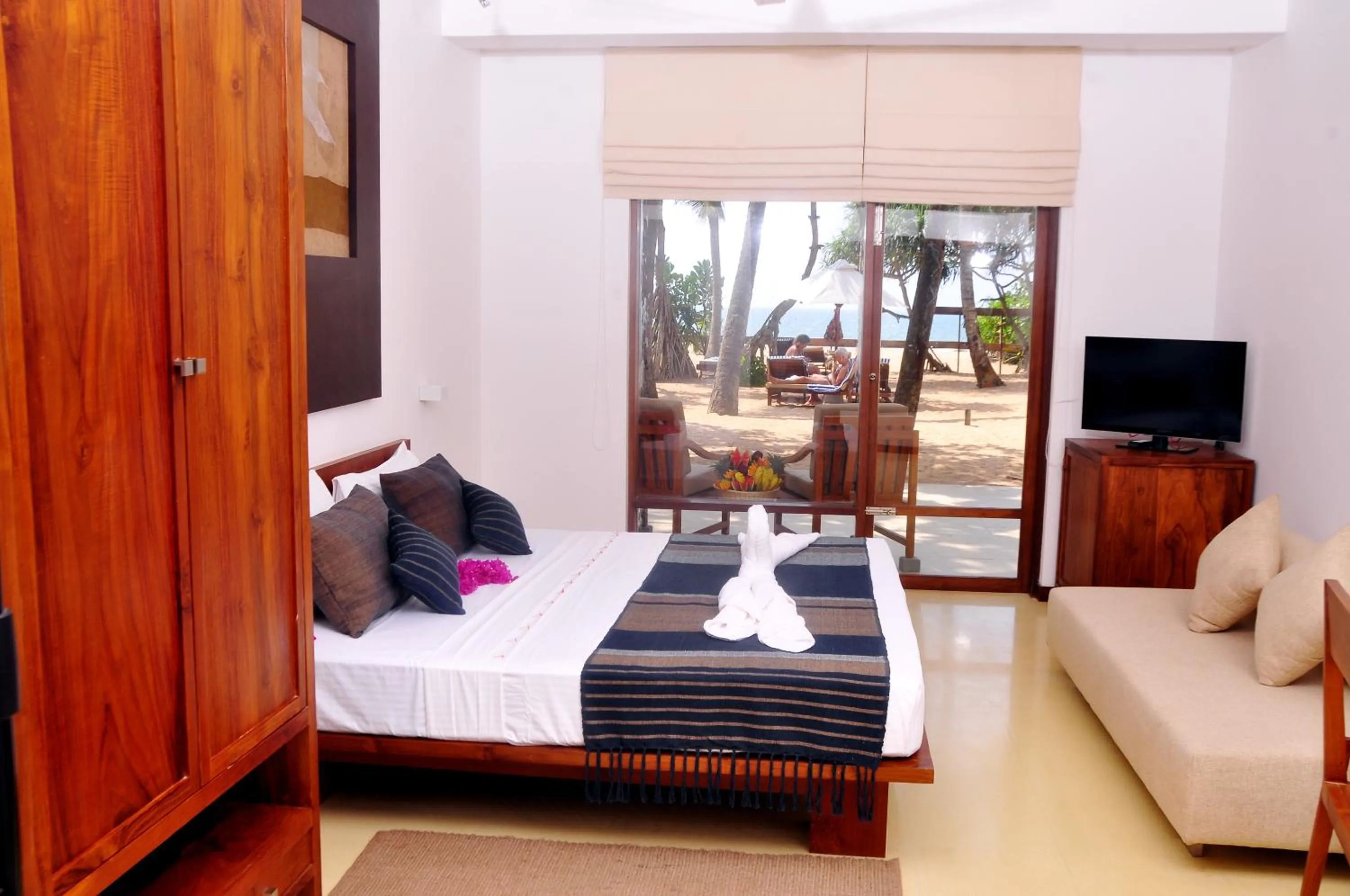 Bed in Pandanus Beach Resort & Spa