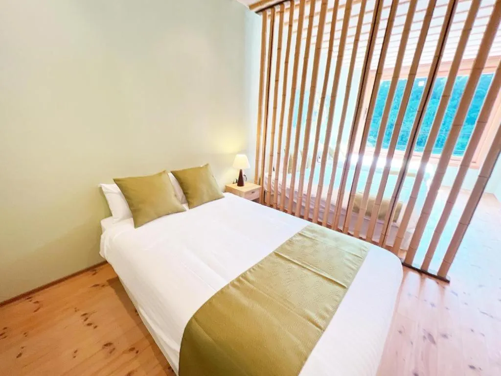 Bed in OWL RESORT ARIFUKU ONSEN