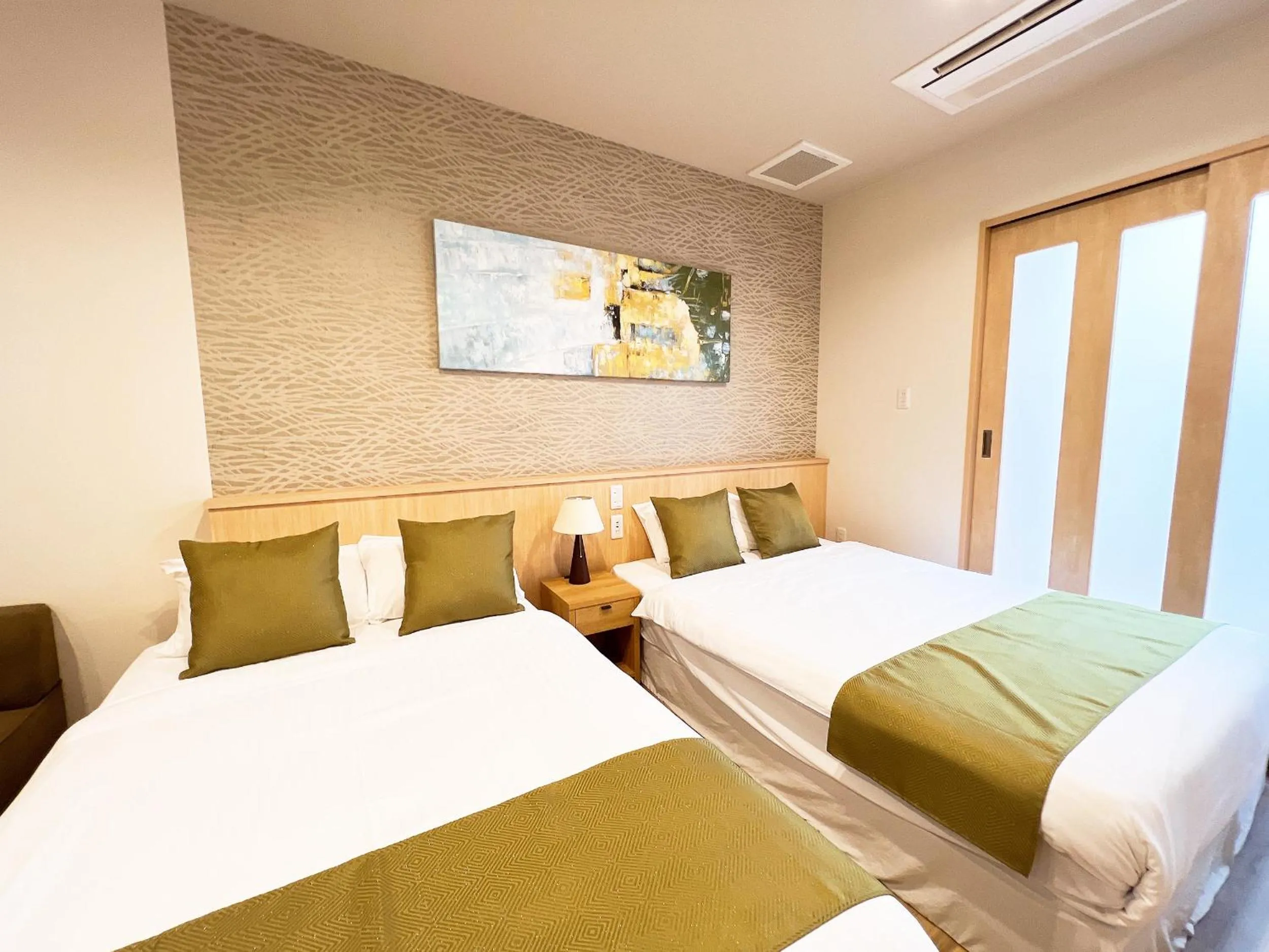 Bed in OWL RESORT ARIFUKU ONSEN