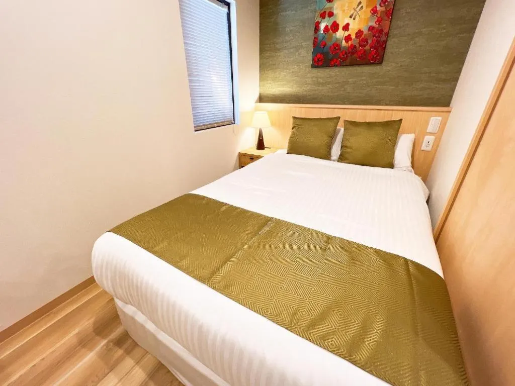 Bed in OWL RESORT ARIFUKU ONSEN