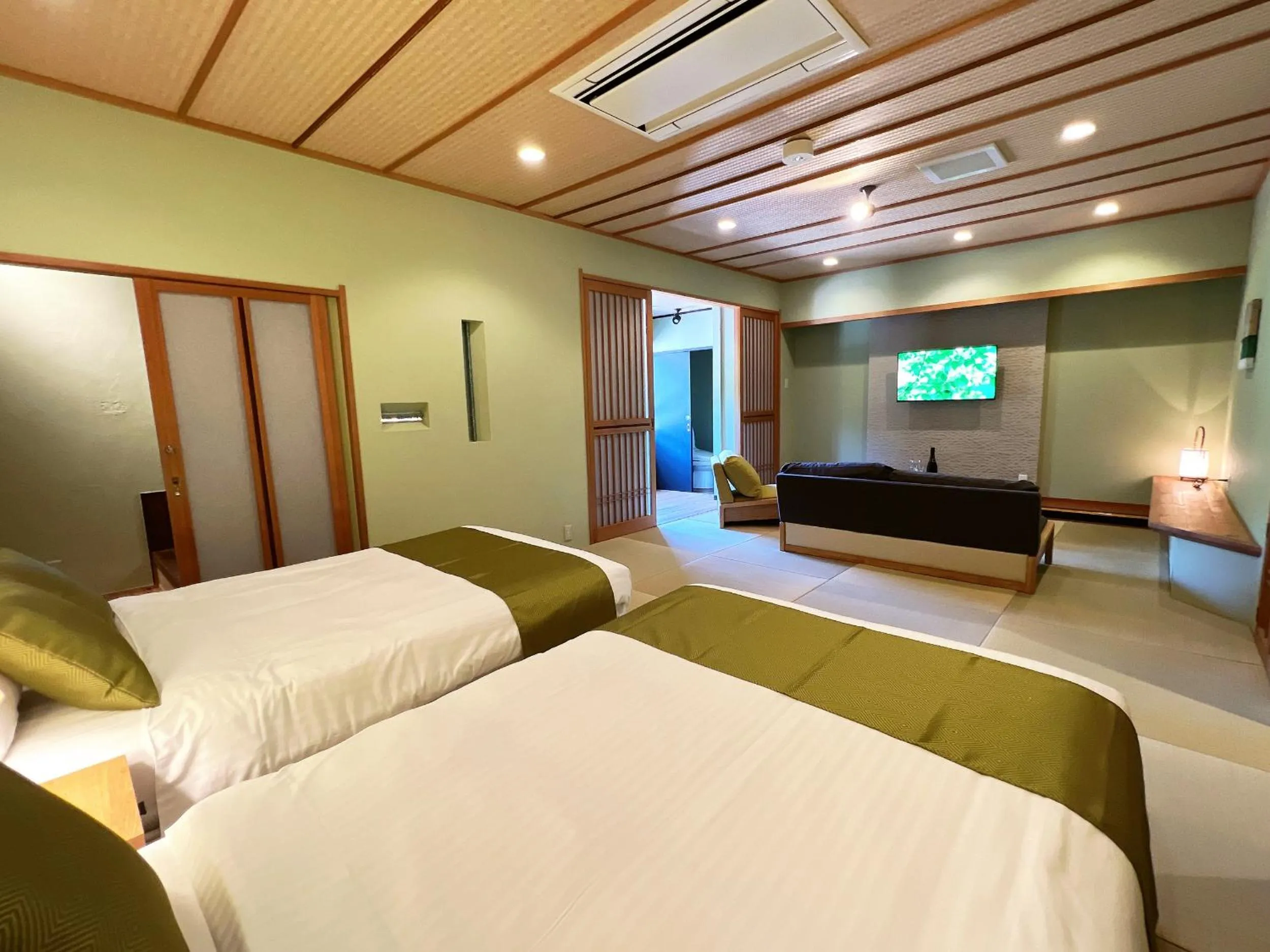 Bed in OWL RESORT ARIFUKU ONSEN