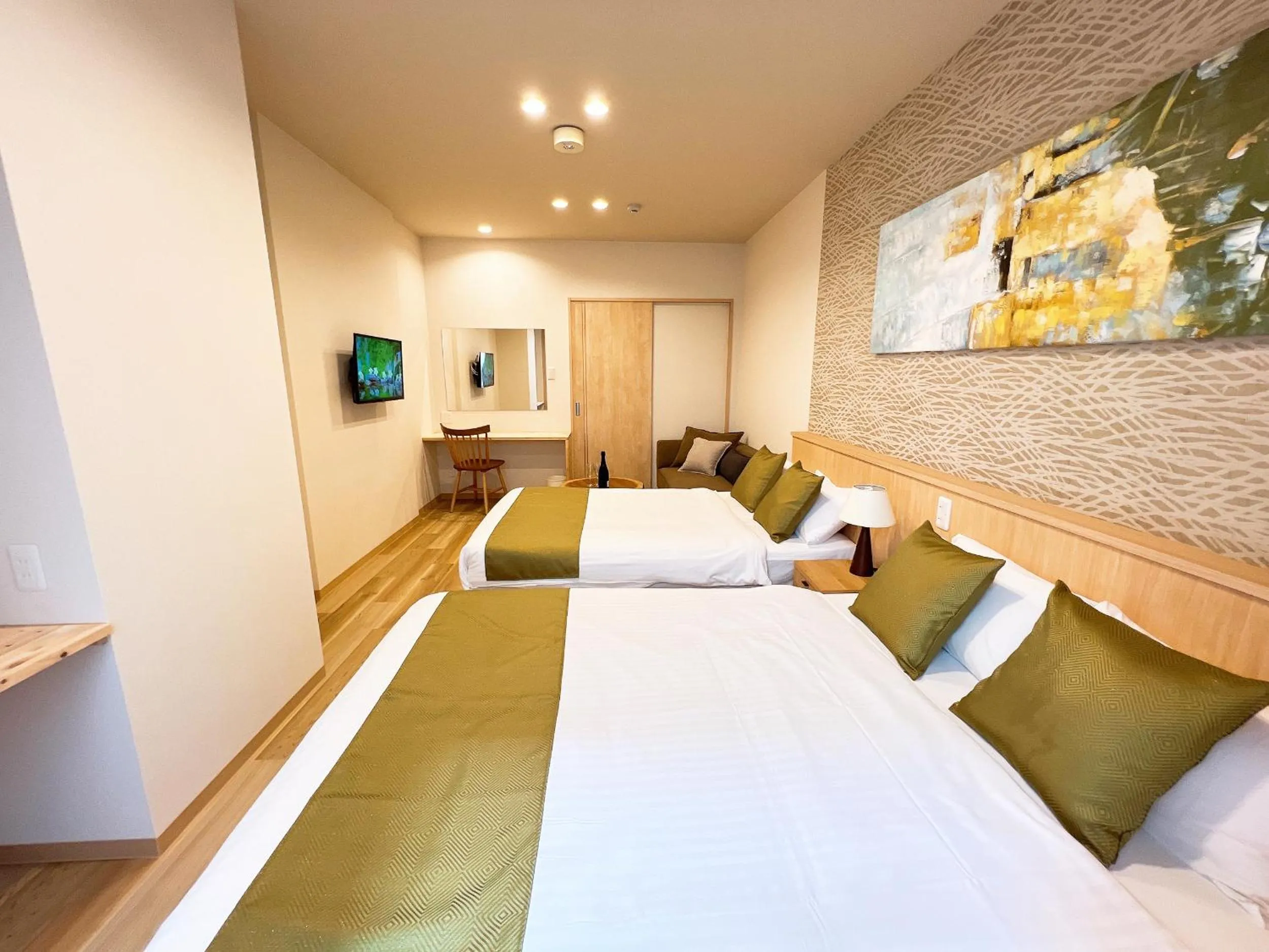 Bed in OWL RESORT ARIFUKU ONSEN