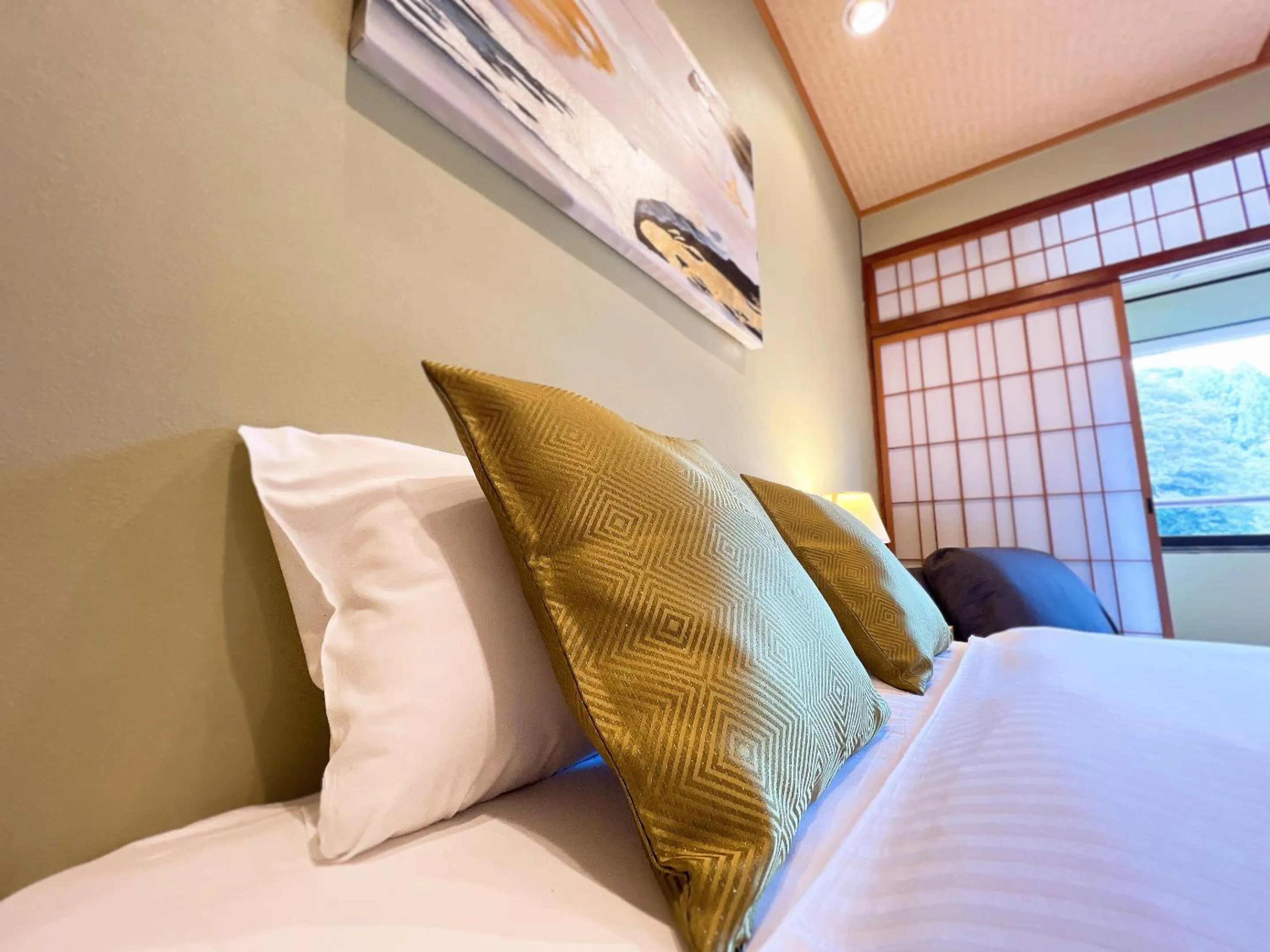 Bed in OWL RESORT ARIFUKU ONSEN