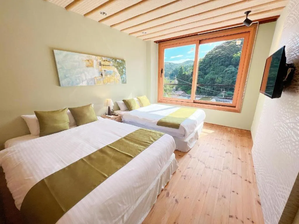 Bed in OWL RESORT ARIFUKU ONSEN