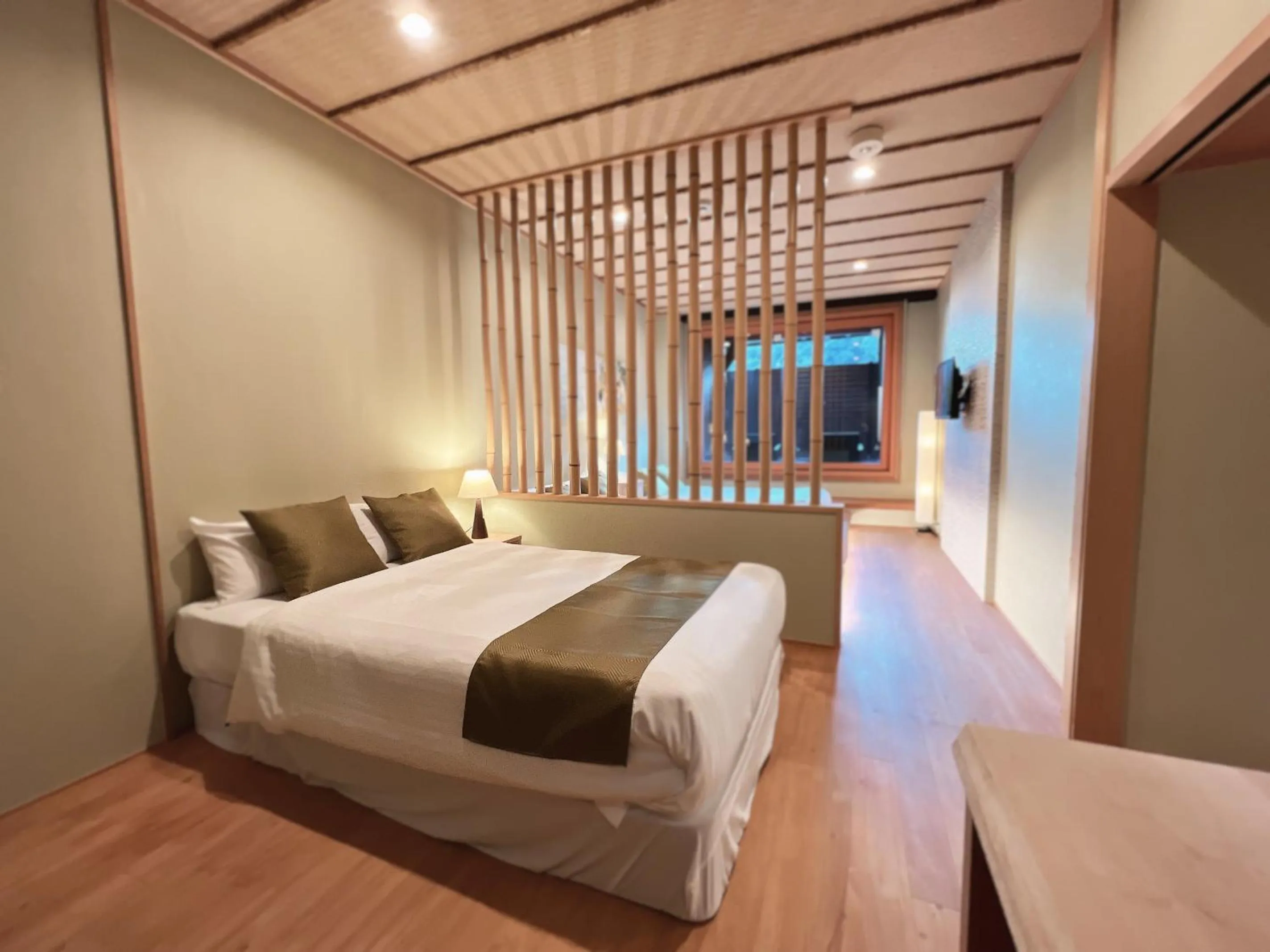 Bed in OWL RESORT ARIFUKU ONSEN