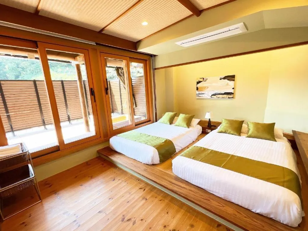 Bed in OWL RESORT ARIFUKU ONSEN