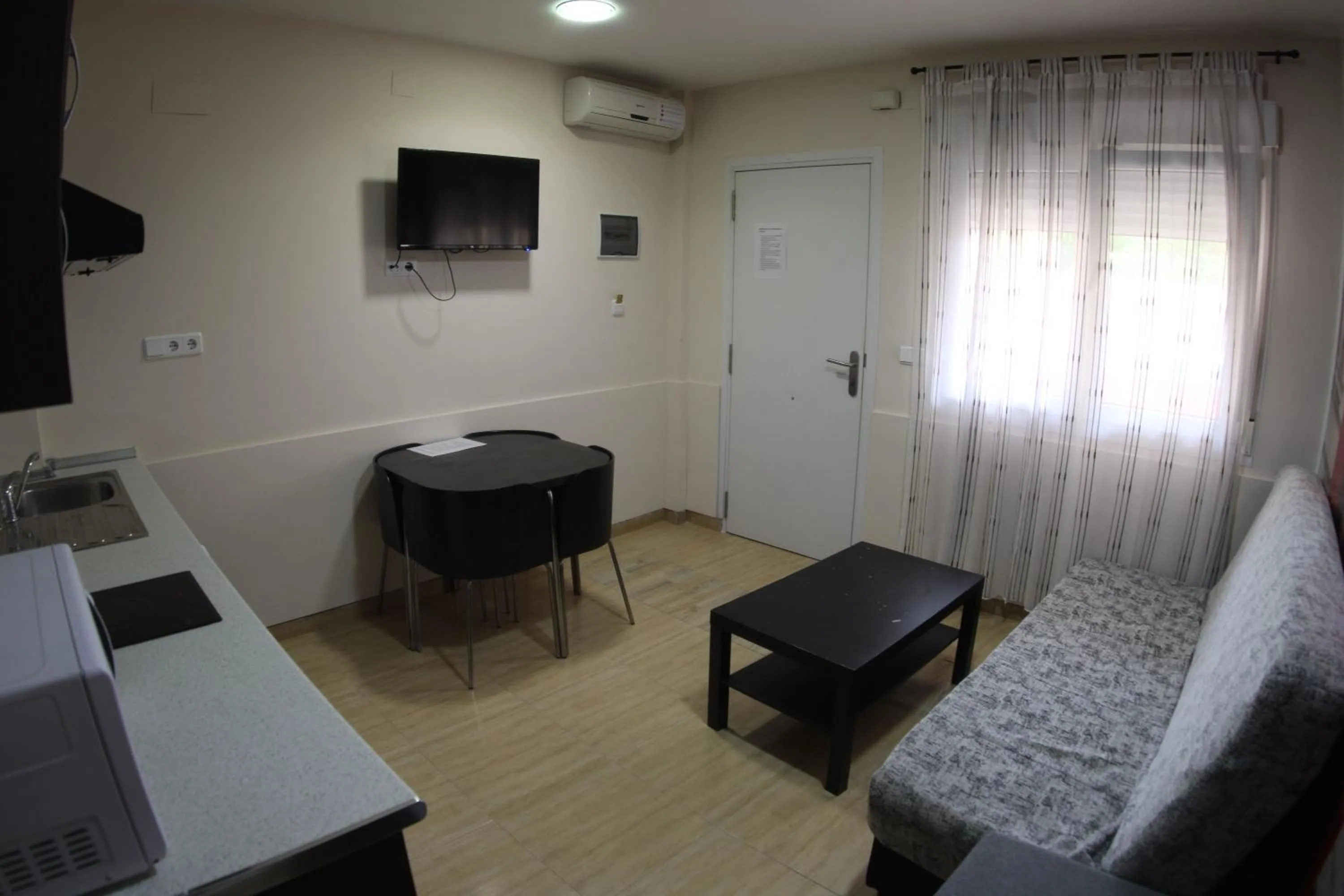 Living room, Bed in Apartamentos Marina Internacional