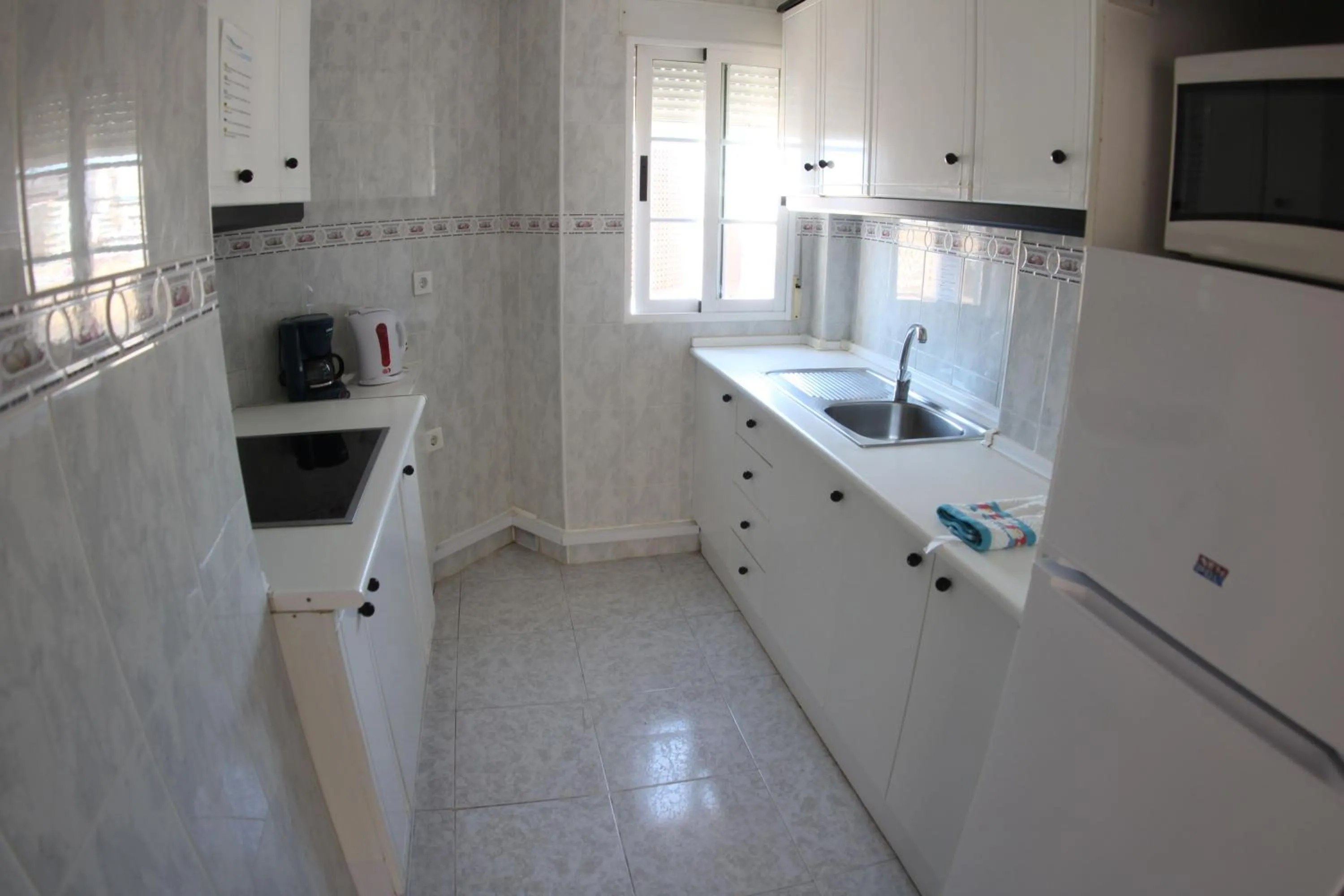 Kitchen or kitchenette in Apartamentos Marina Internacional