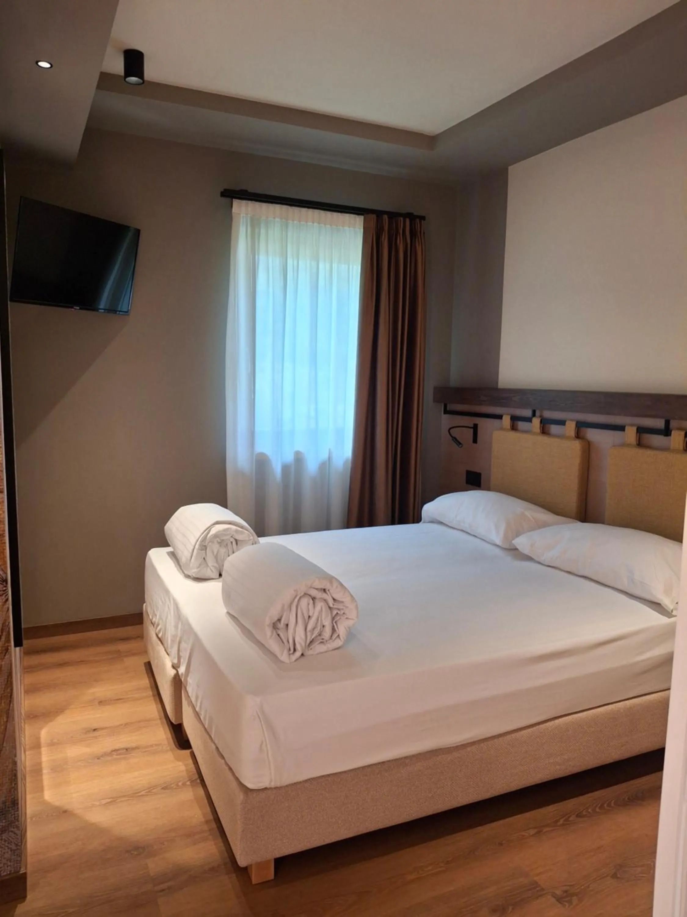 Bed in Hotel Dolomiti Saone