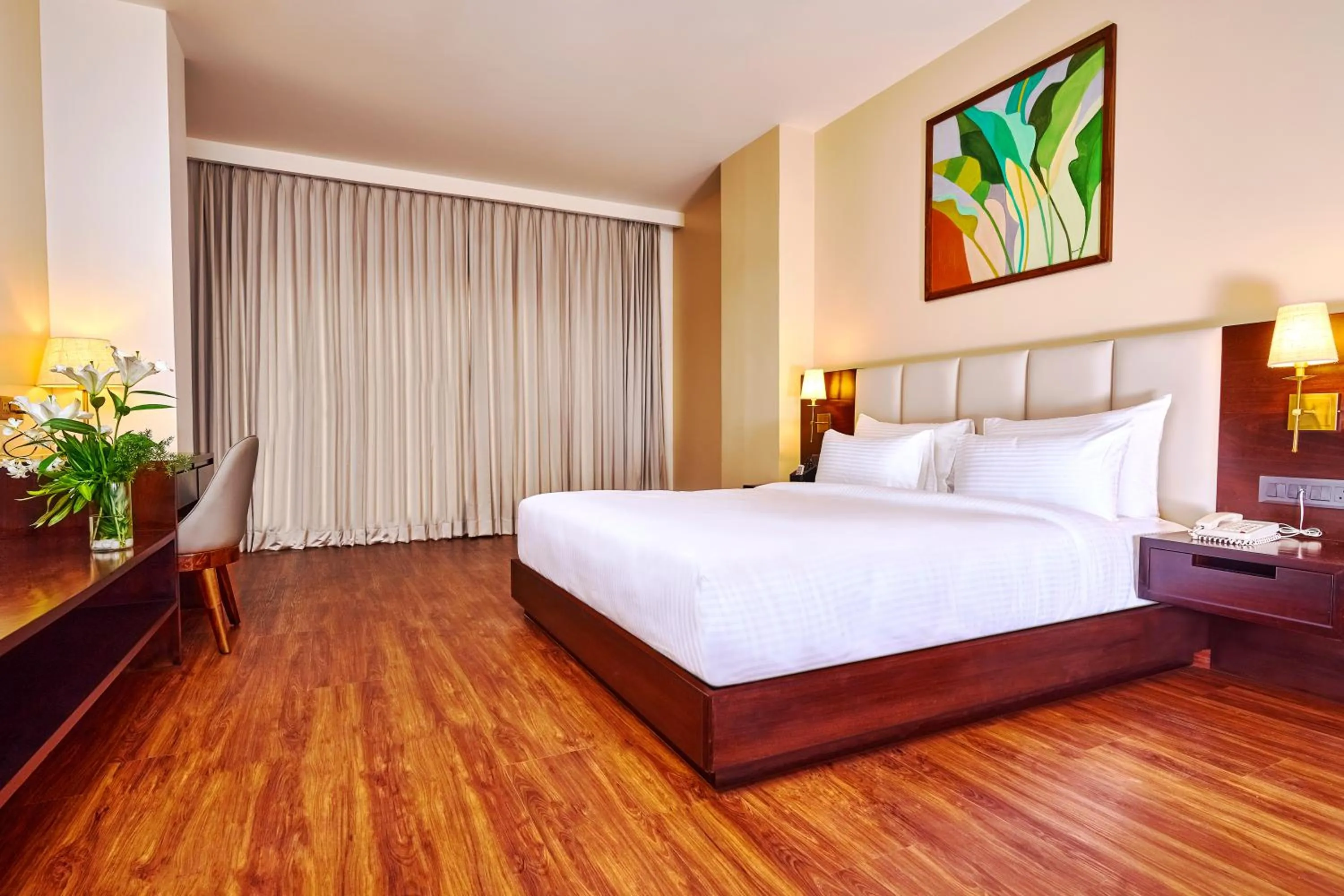 Bed in Visthara Hotel