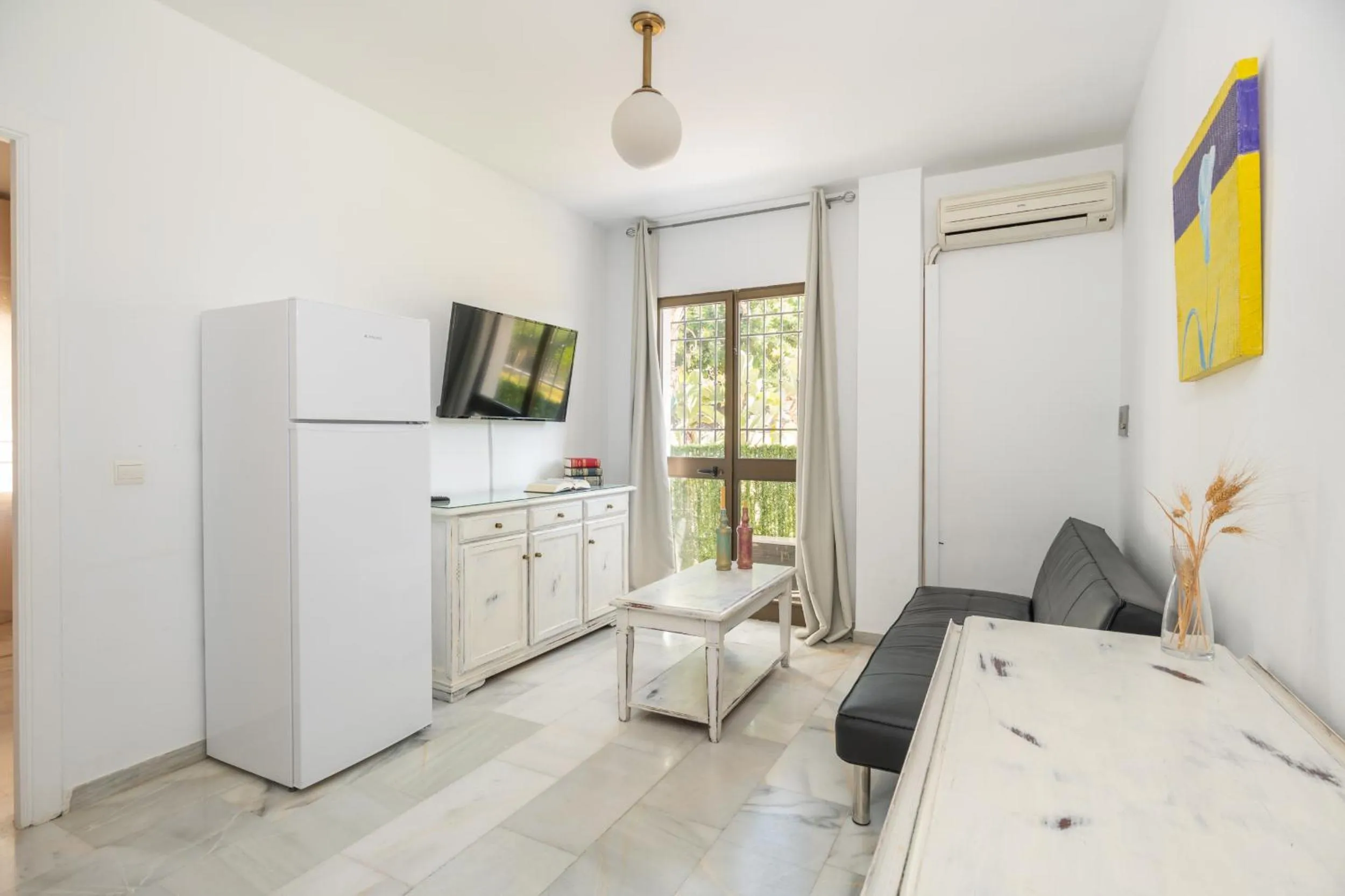 Living room, Bed in Apartahotel Playamaro by Dorobe