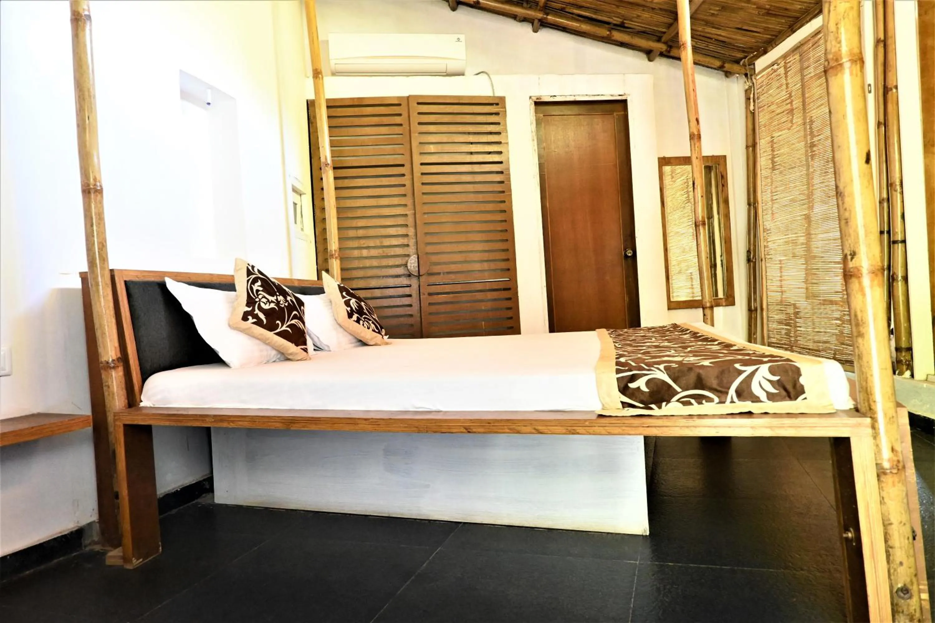 Bed in Amraness Luxury Resort Sasan Gir