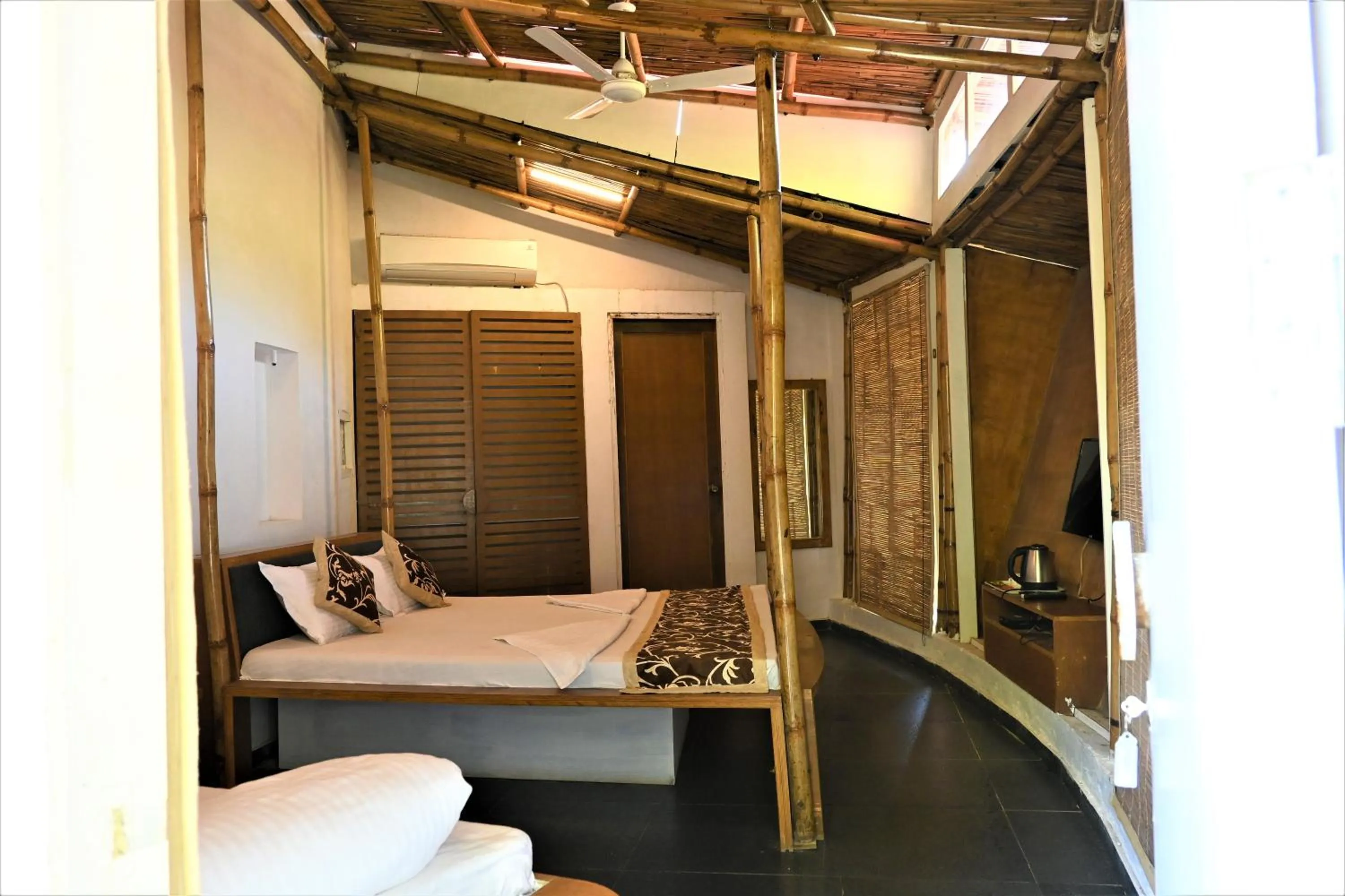 Photo of the whole room, Bed in Amraness Luxury Resort Sasan Gir