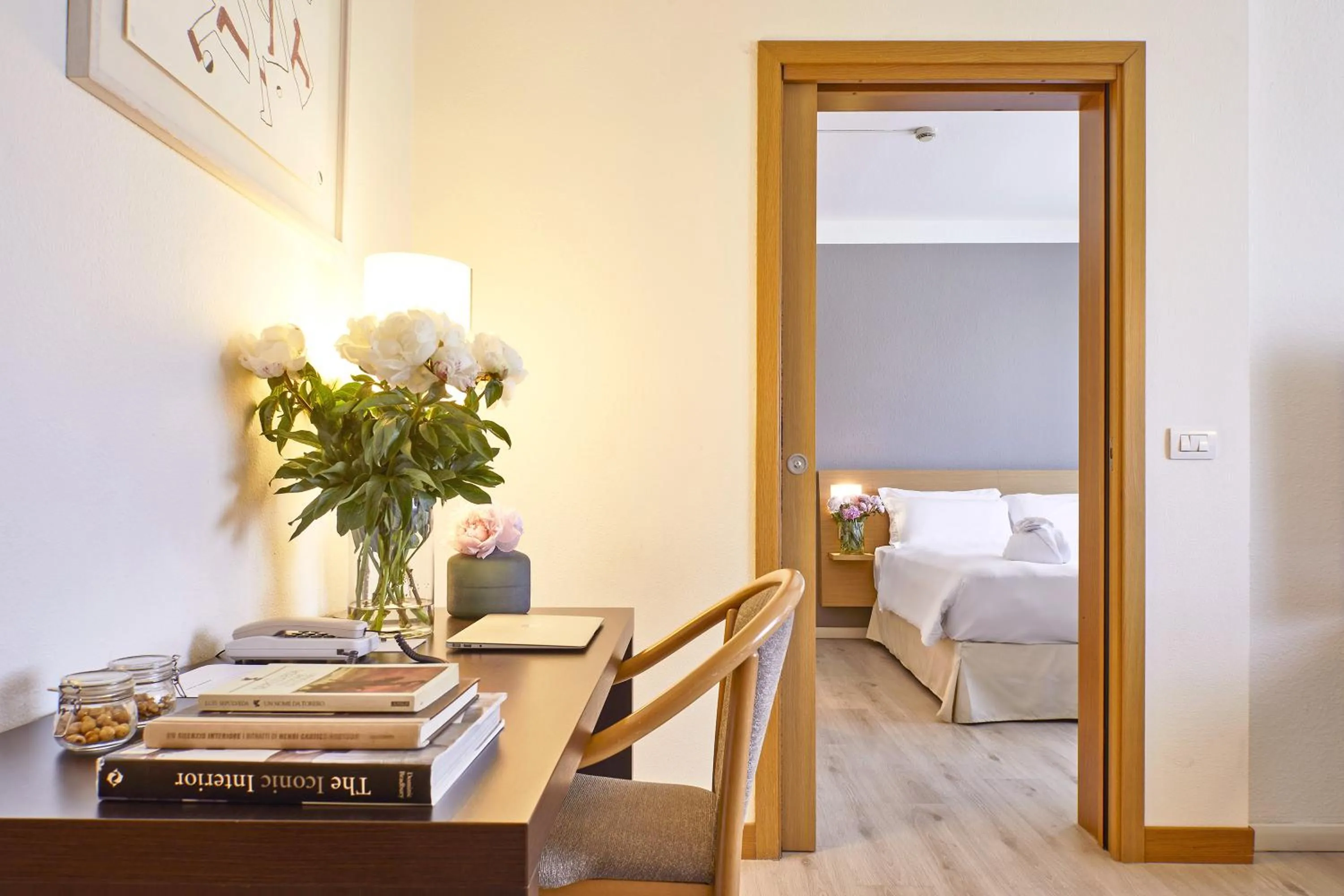 Seating area, Bed in Living Place Hotel