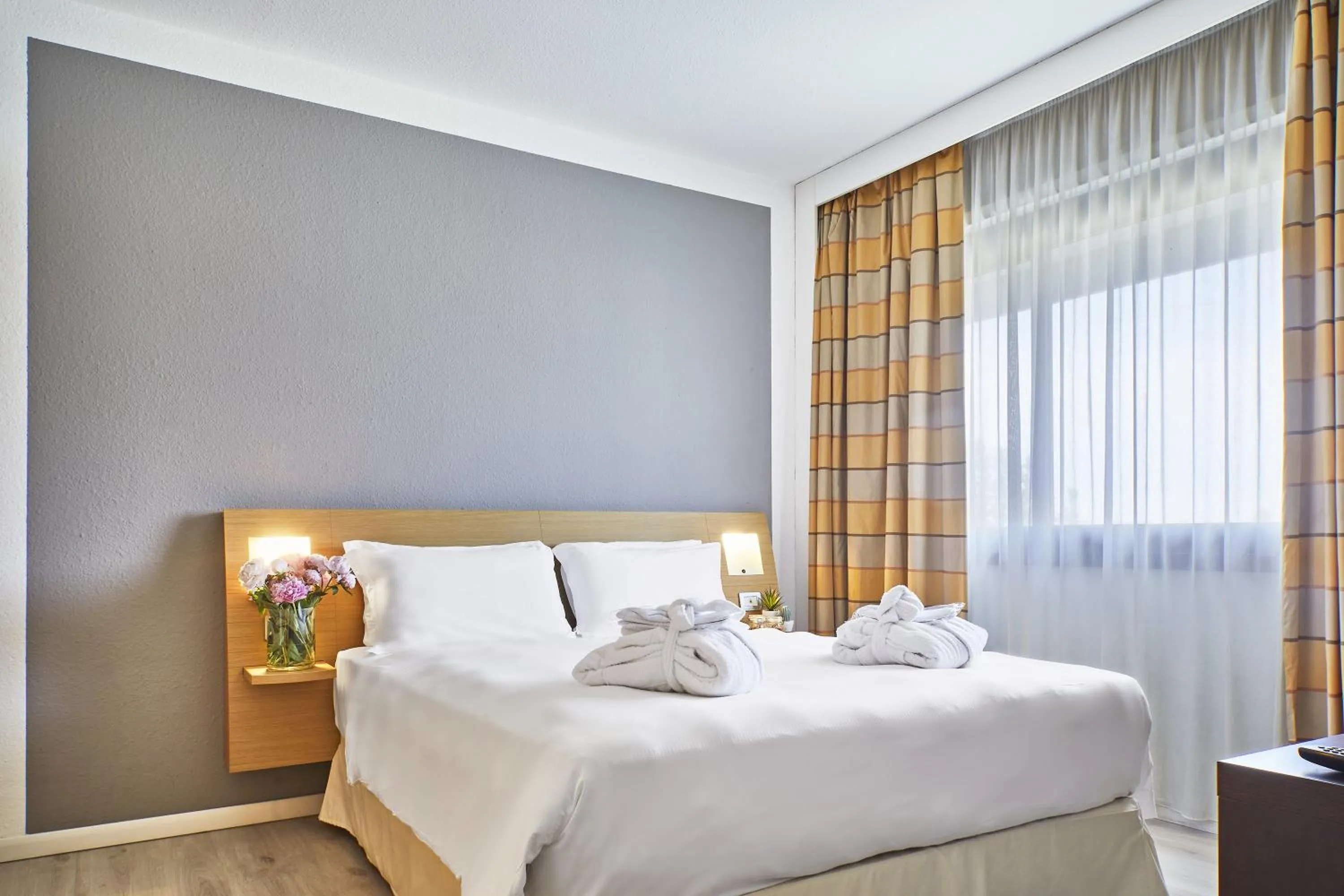 Bed in Living Place Hotel