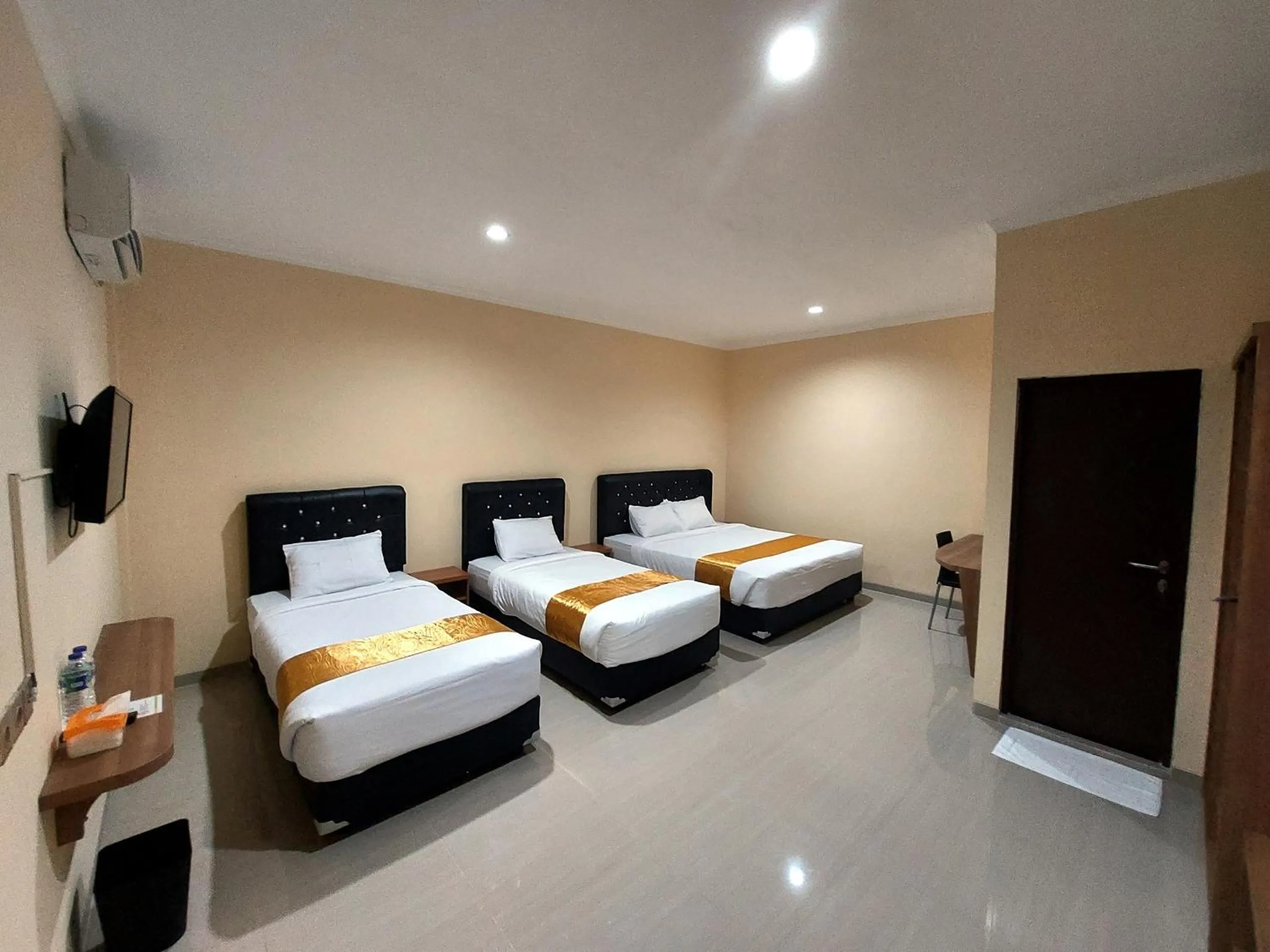Bed in Harmony Inn Belitung - City Hotel