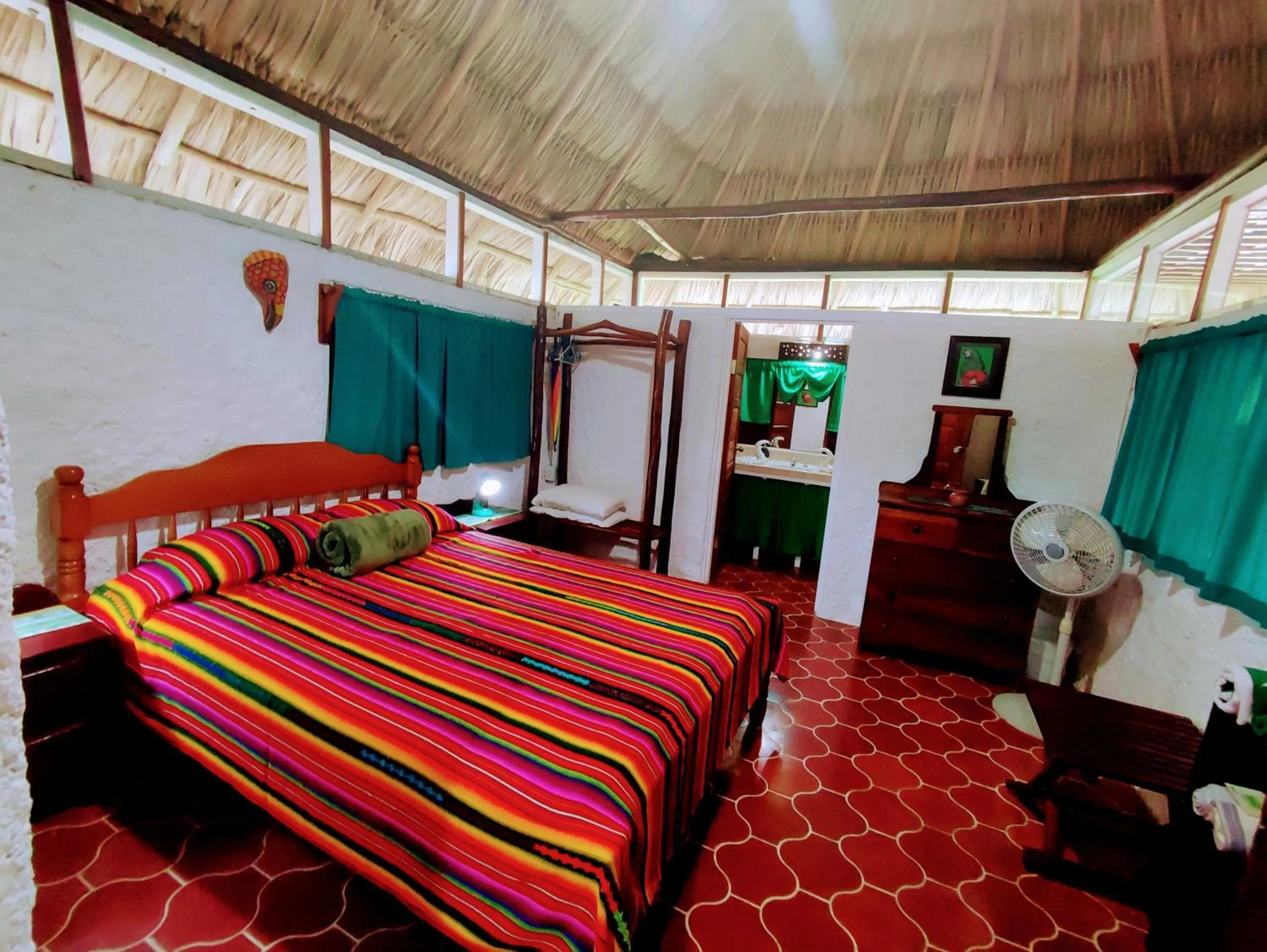 Bed in Maya Mountain Lodge