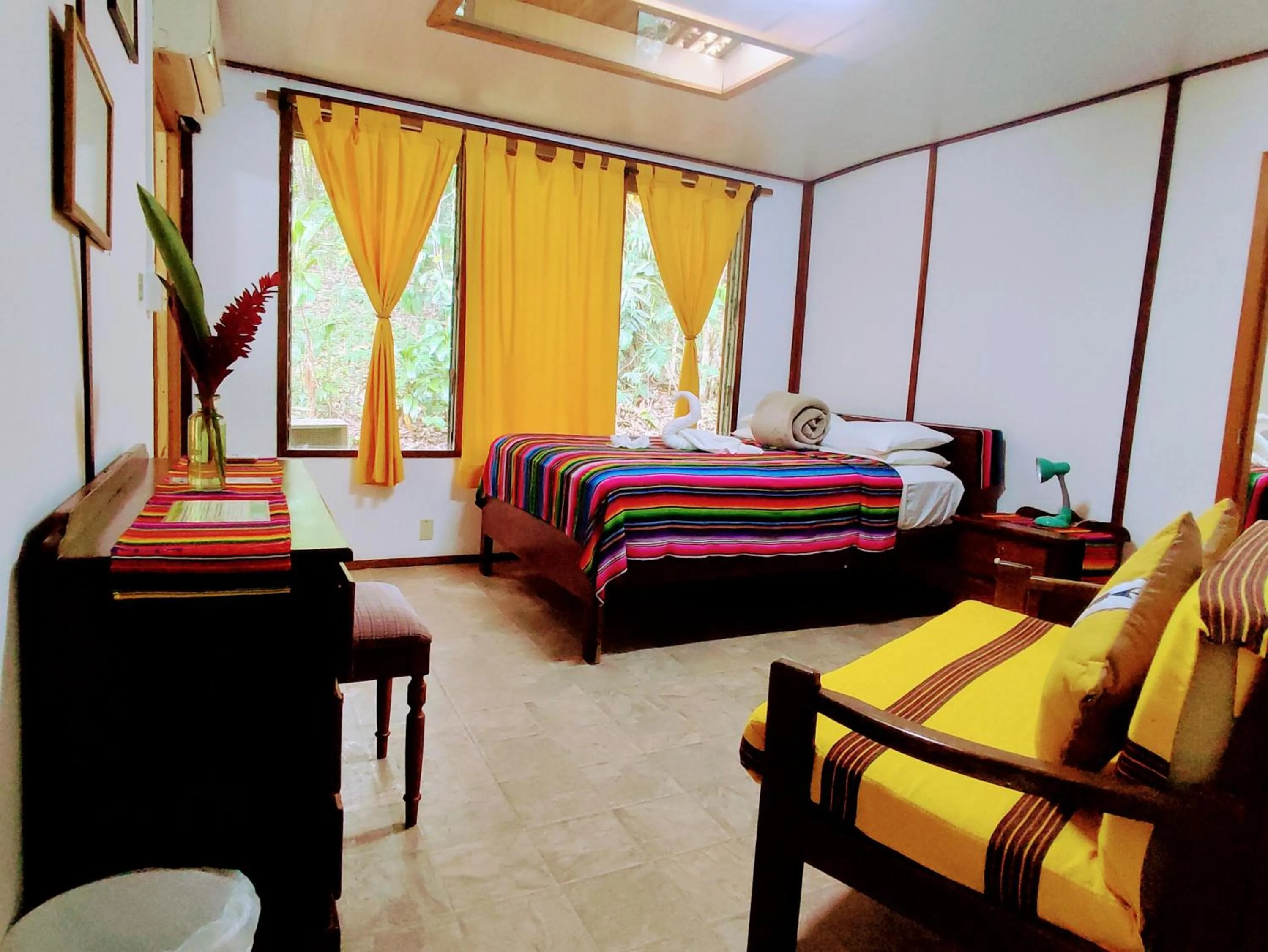 Bed in Maya Mountain Lodge