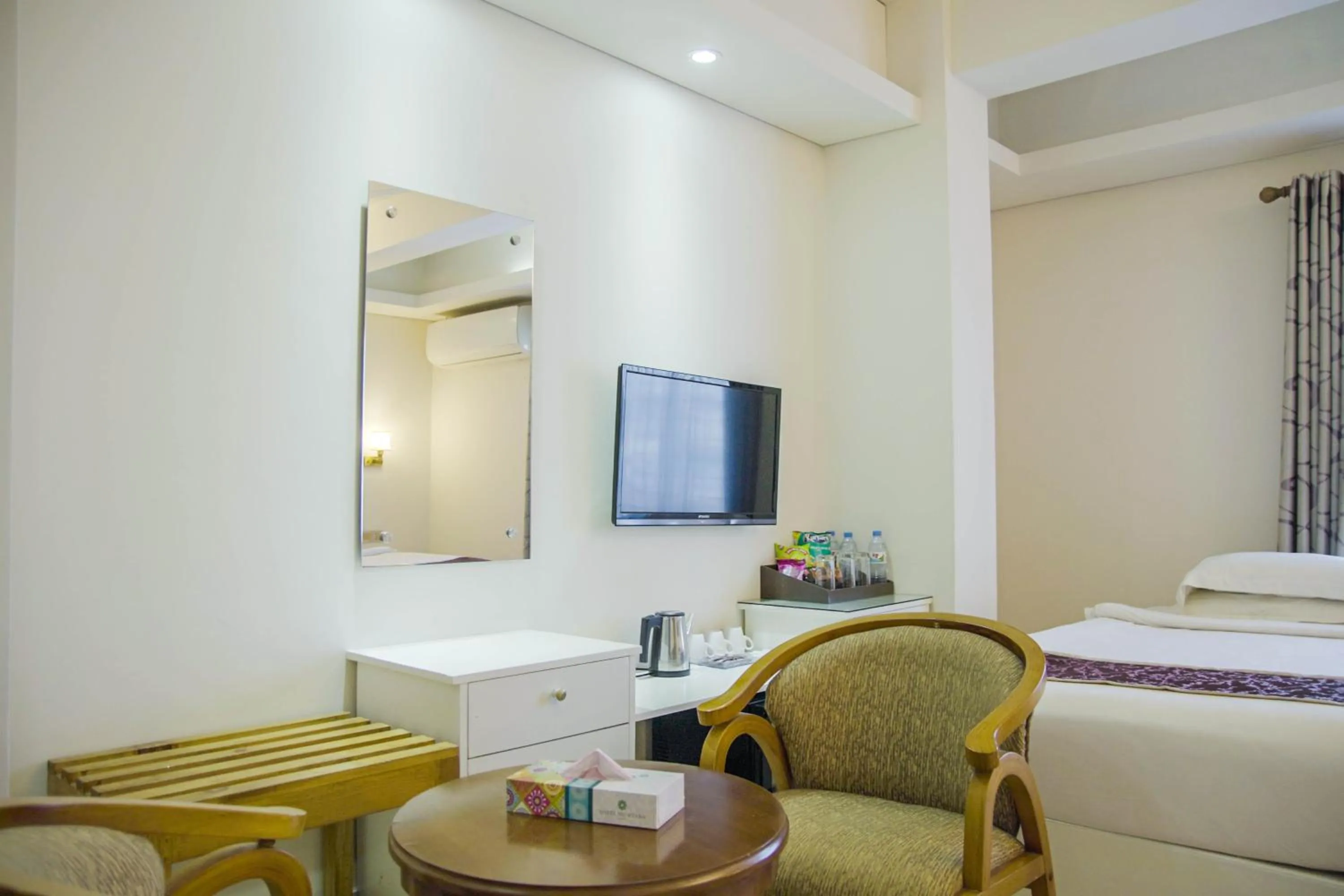 Seating area, Bed in Hotel Shuktara Dhaka