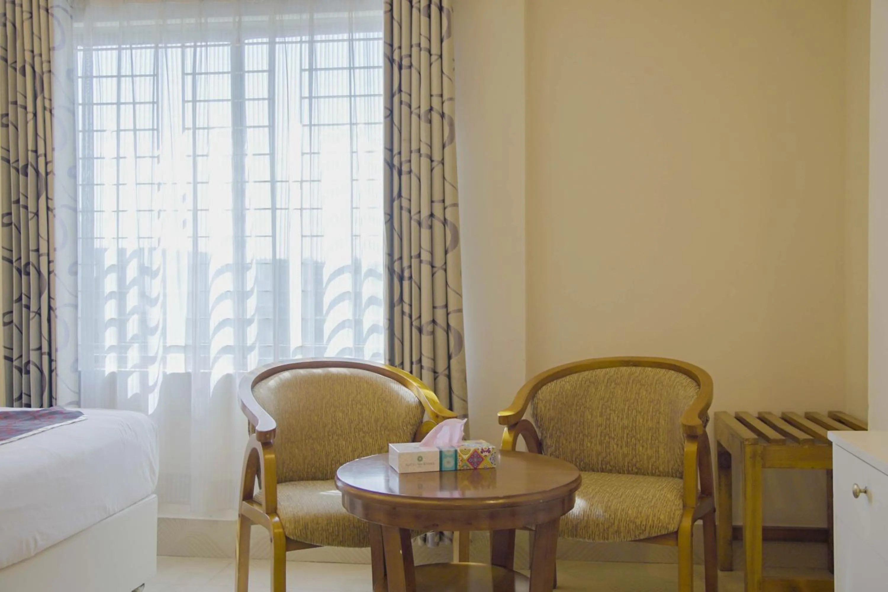 Seating area, Bed in Hotel Shuktara Dhaka
