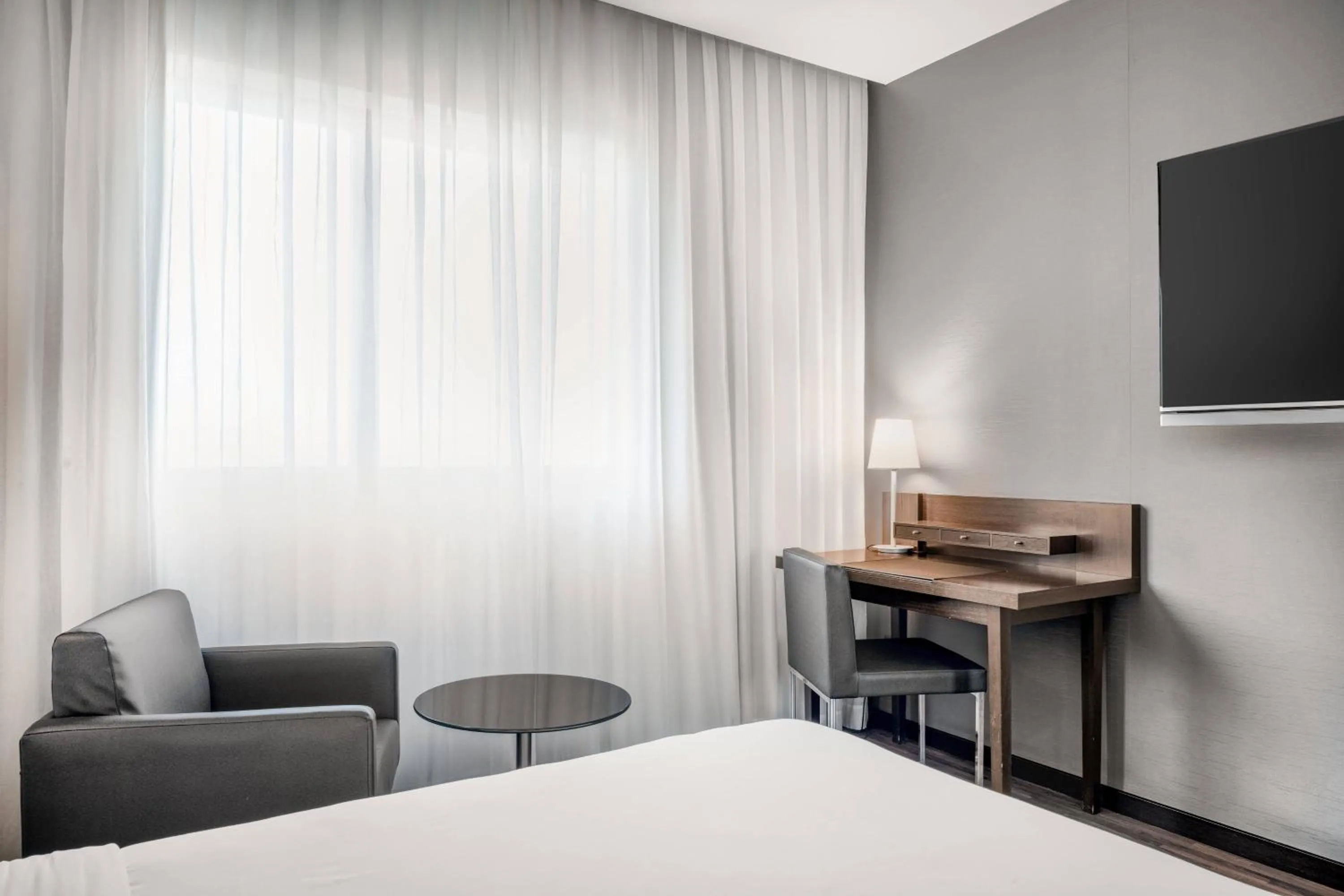 Photo of the whole room, Bed in AC Hotel Gijón by Marriott