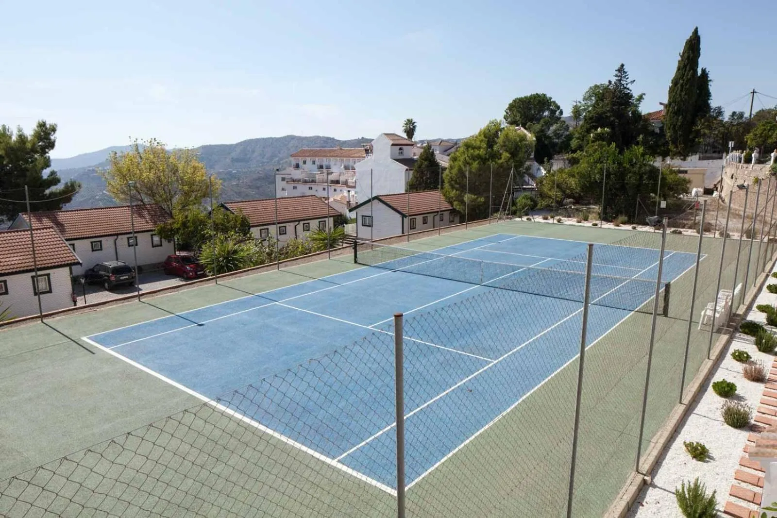 Tennis court in Hotel y Bungalows Balcón de Competa