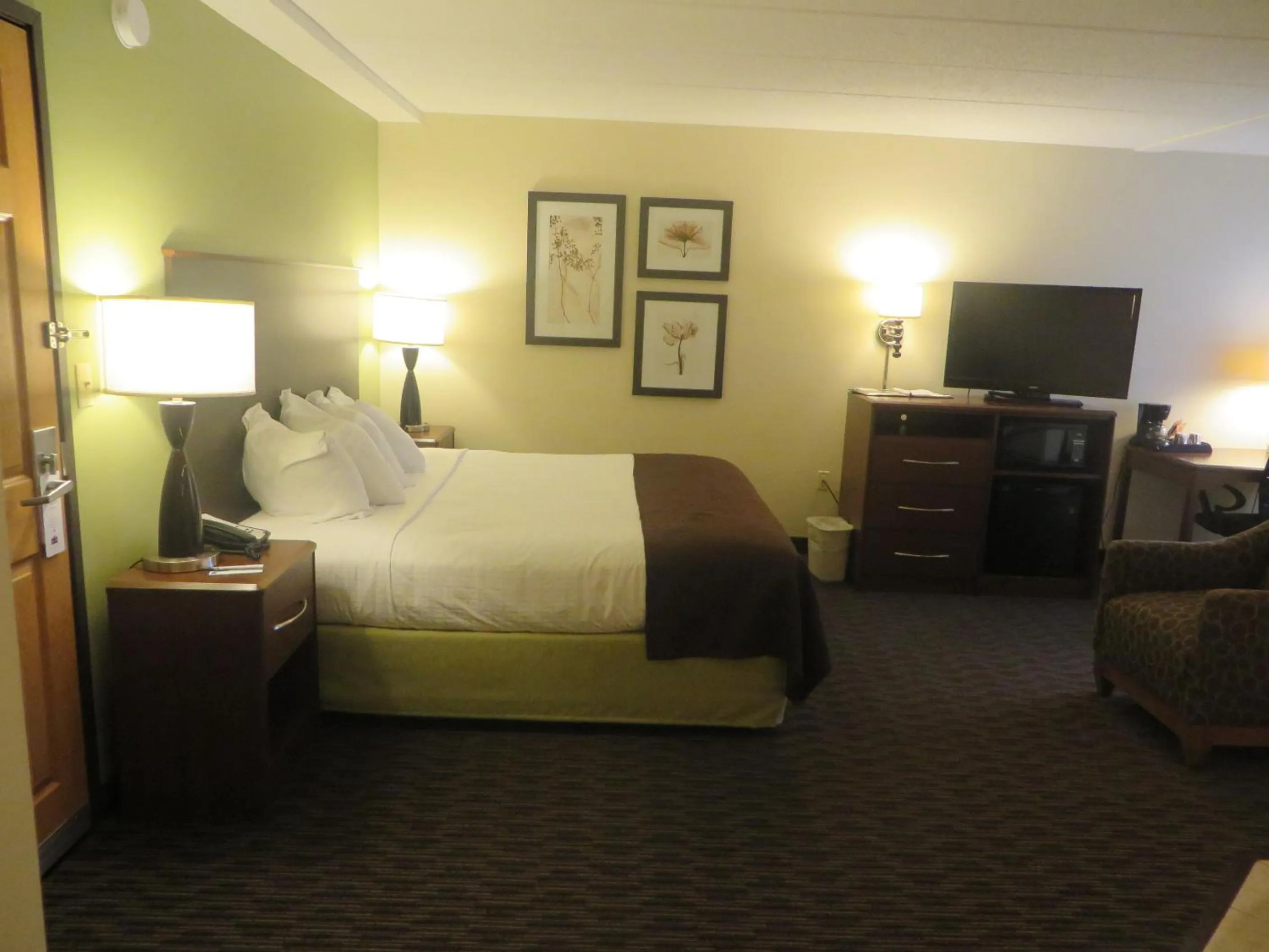 Bed in AmericInn by Wyndham Rice Lake