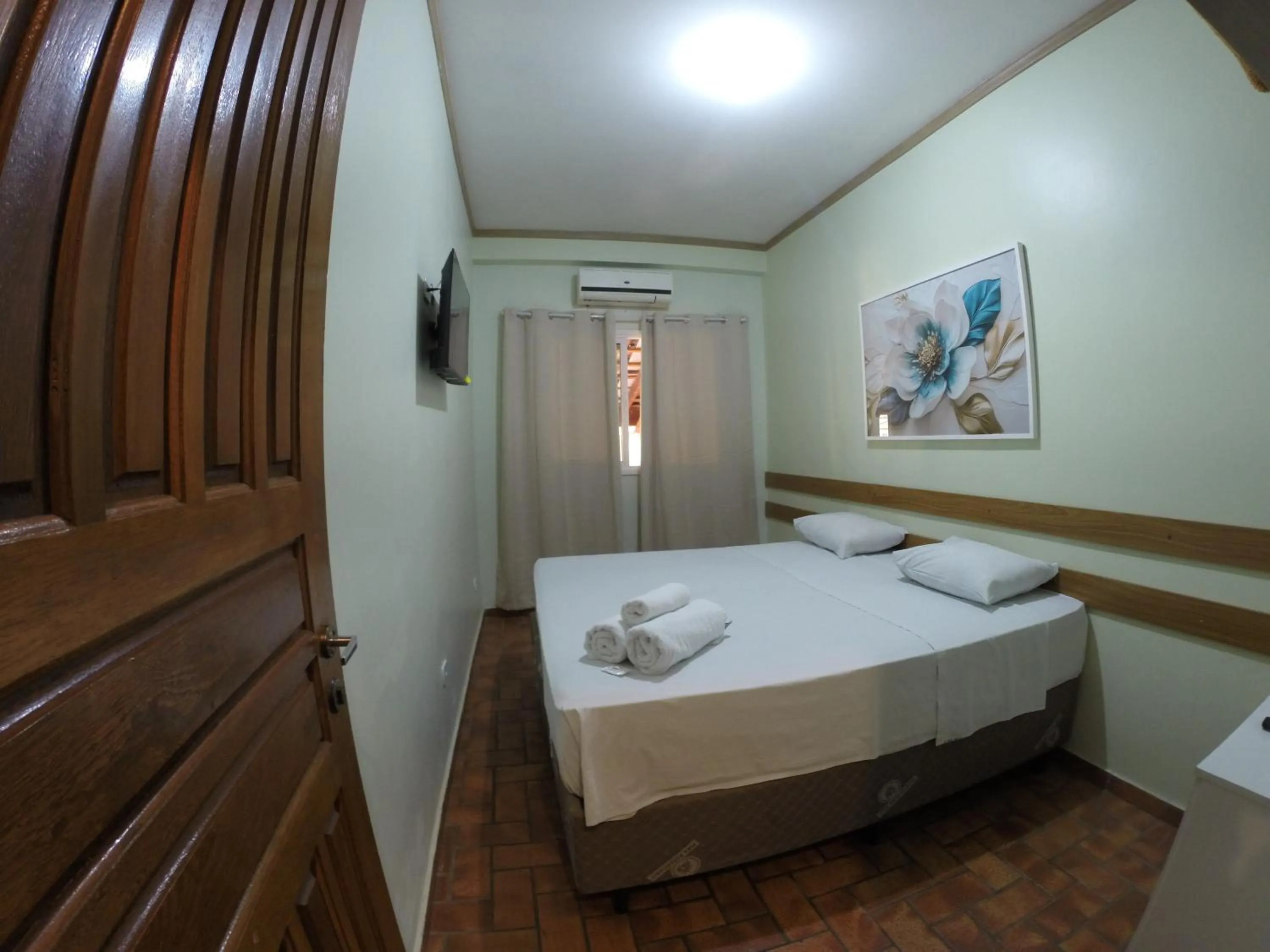 Bed in POUSADA EVELINA