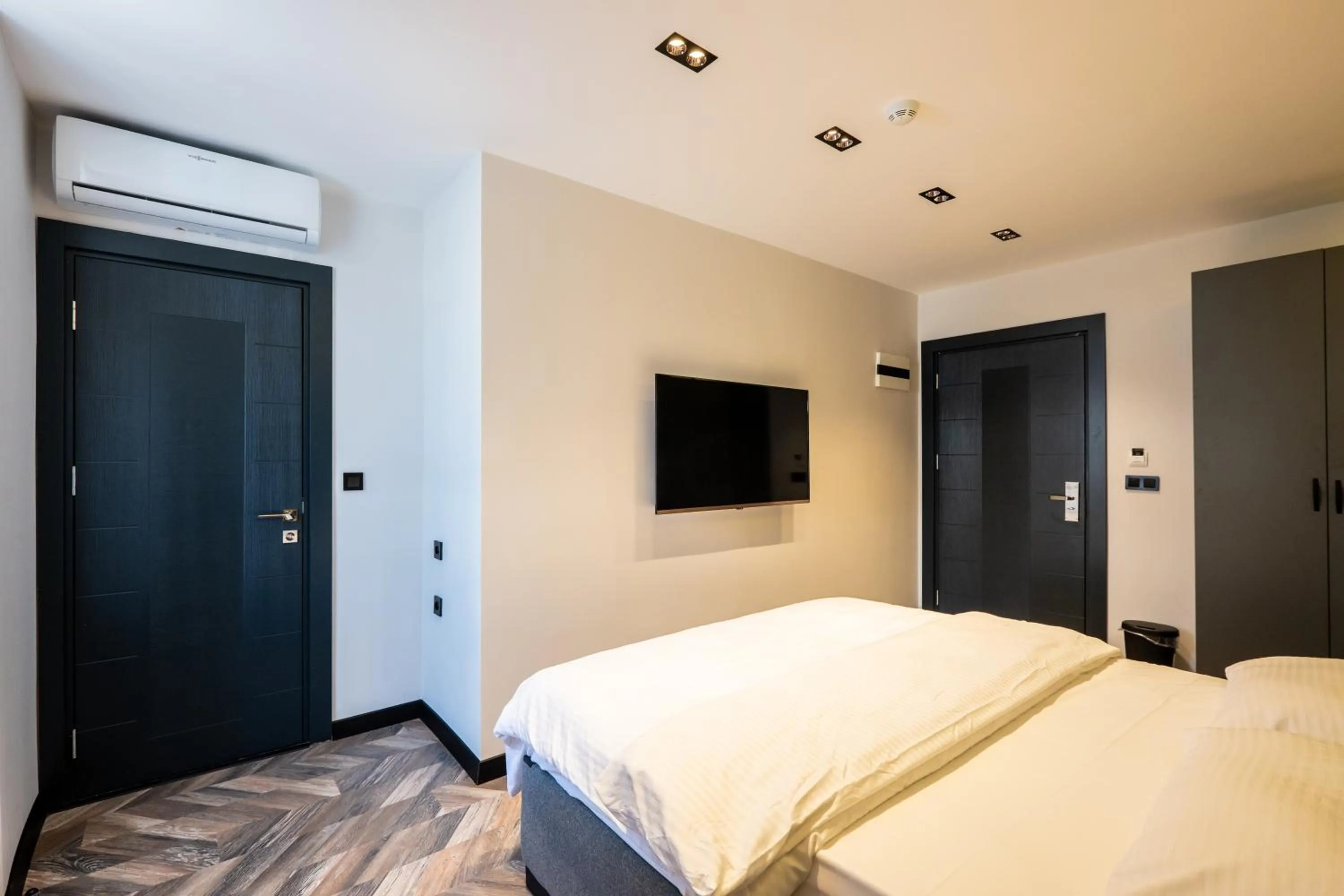 Bed in Angelo Coffee Suites