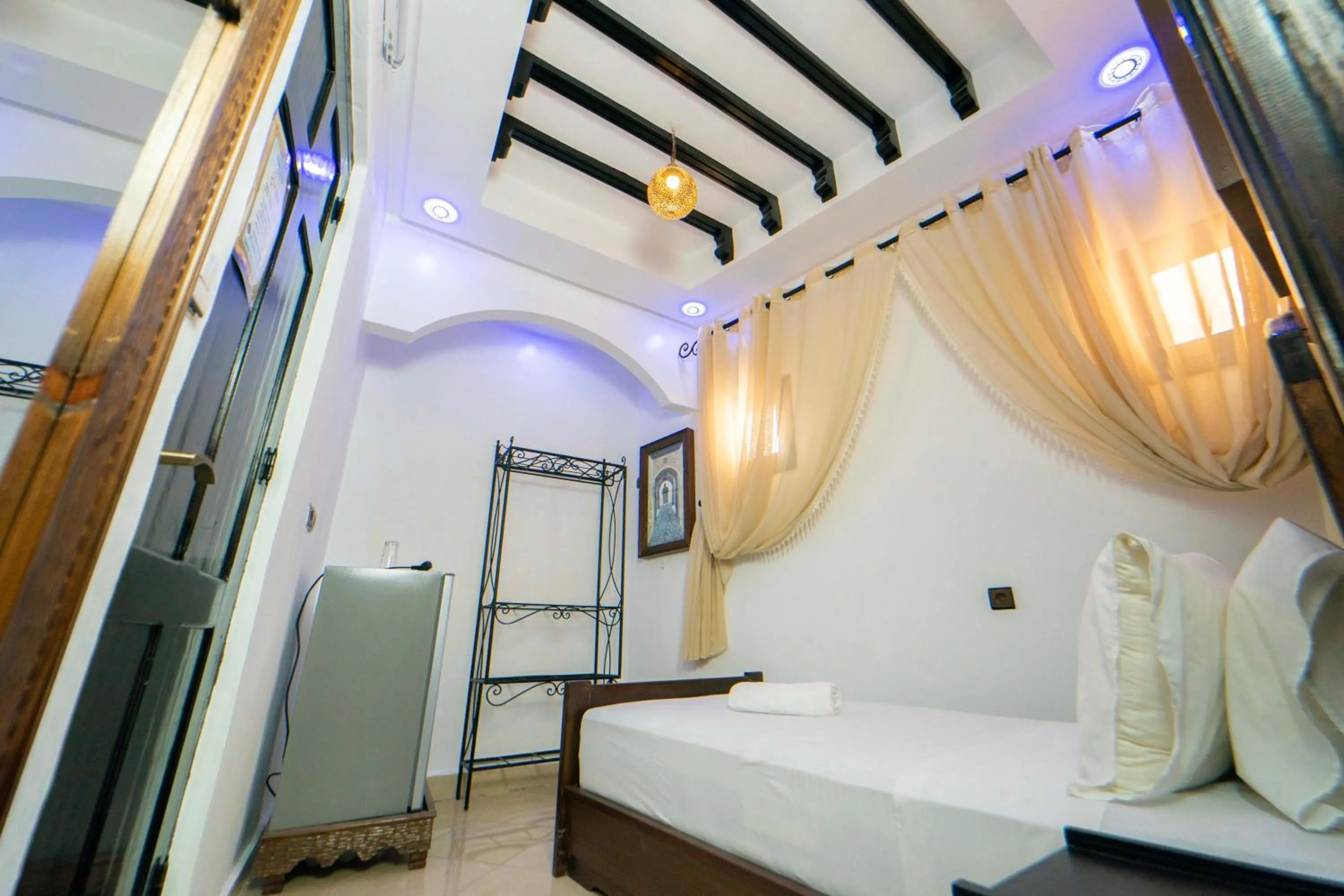 Bed in Maison d'hôtes Afassi