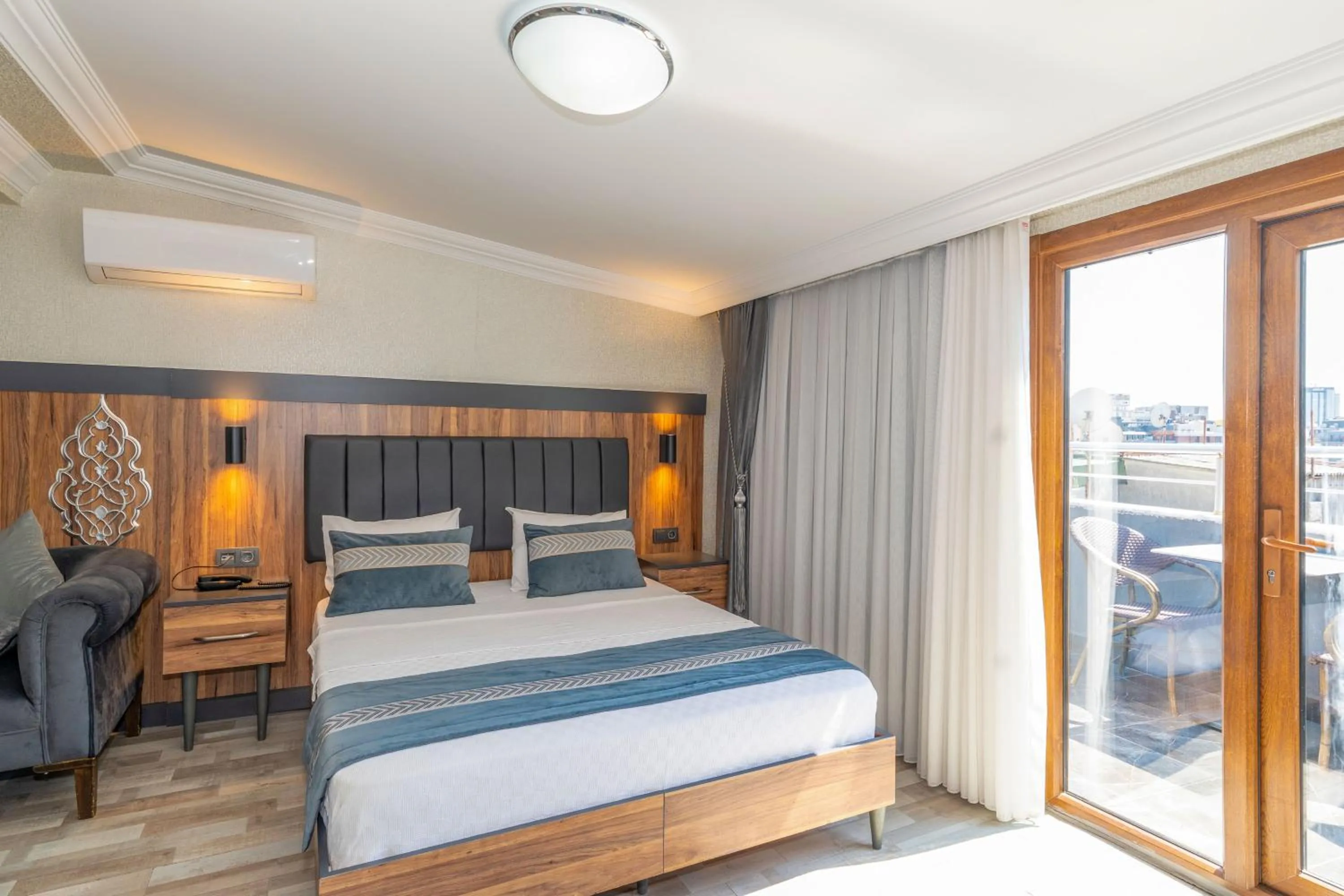 Bed in La Serena Taxim Hotel