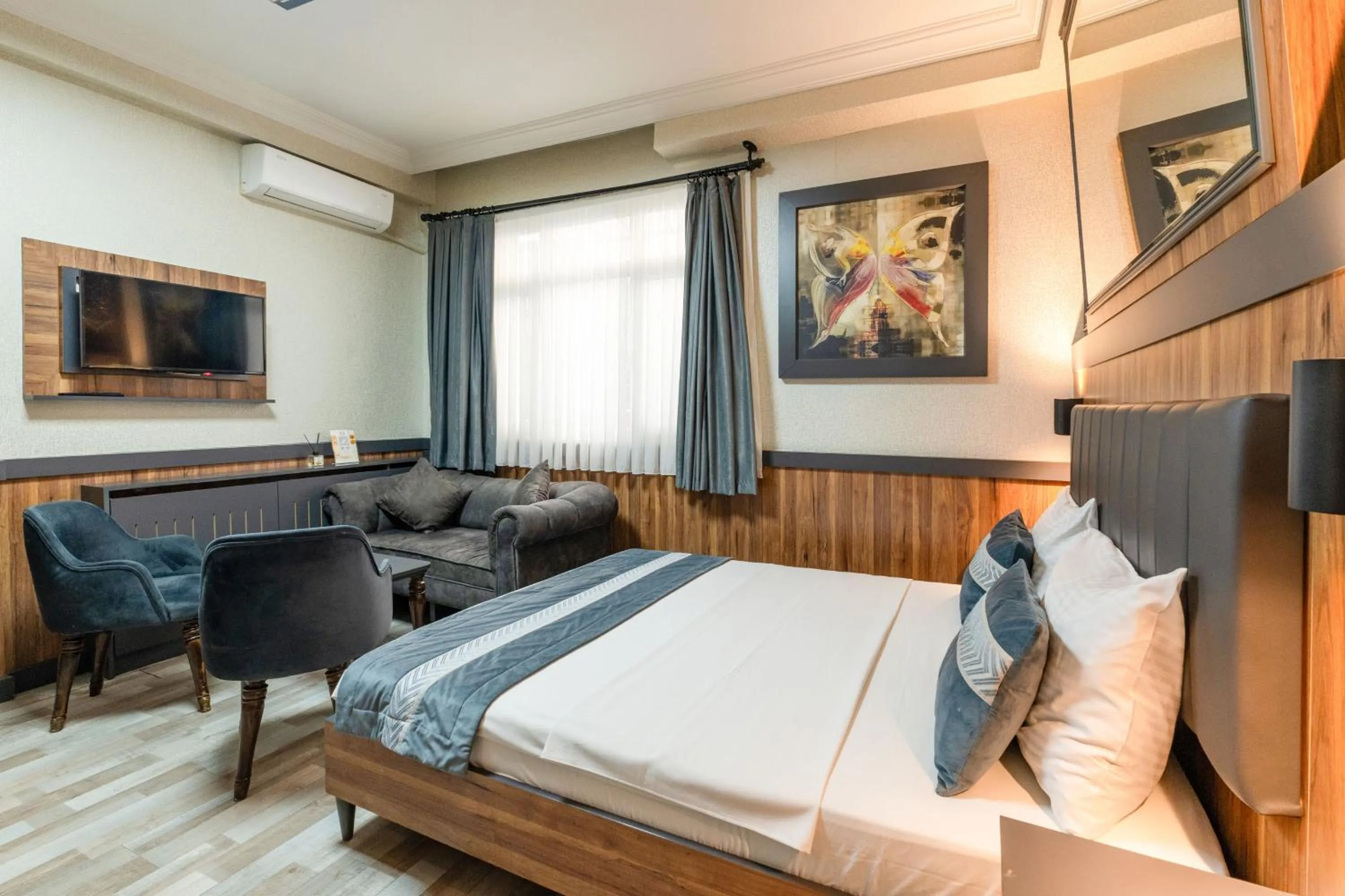 Bed in La Serena Taxim Hotel