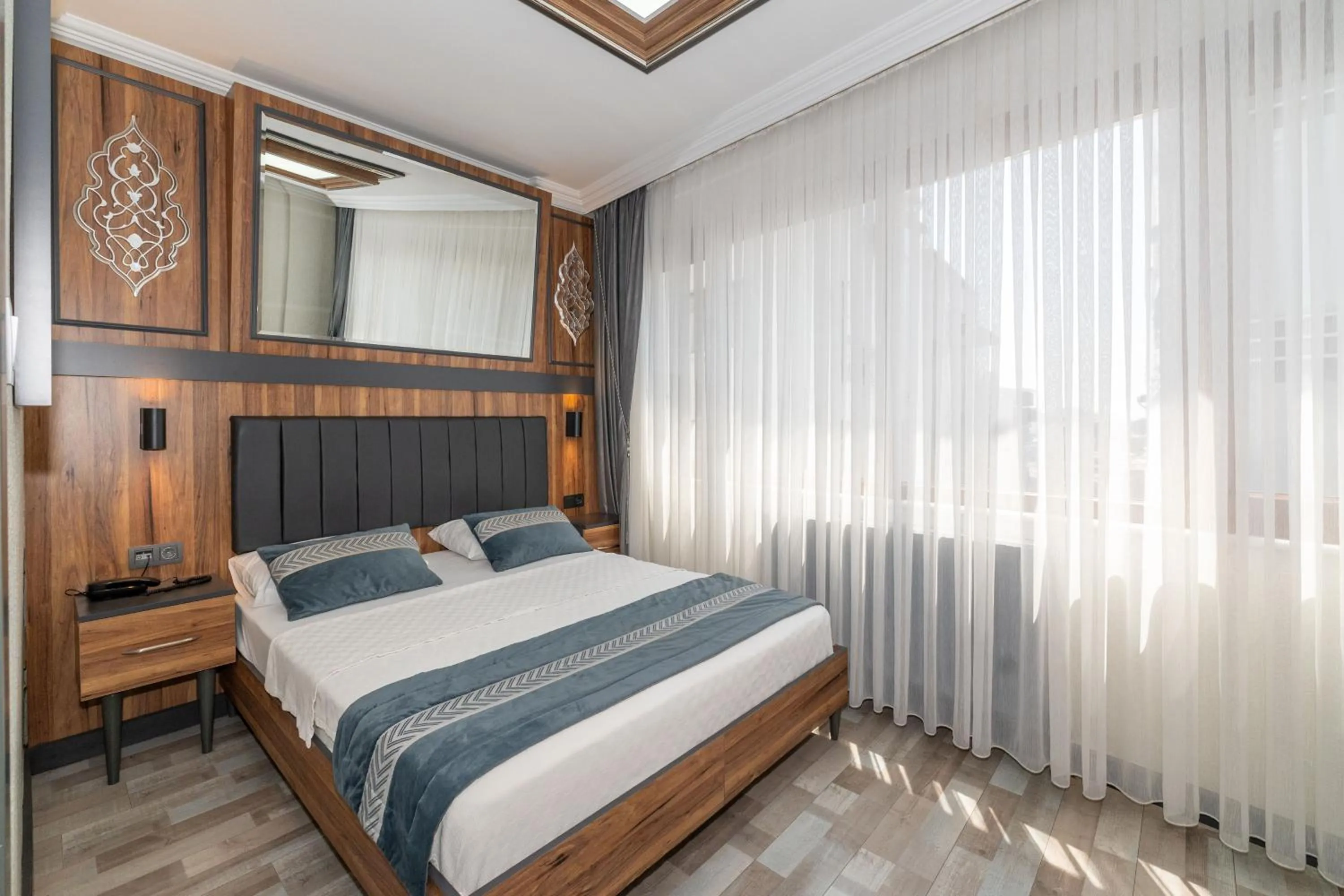 Bed in La Serena Taxim Hotel