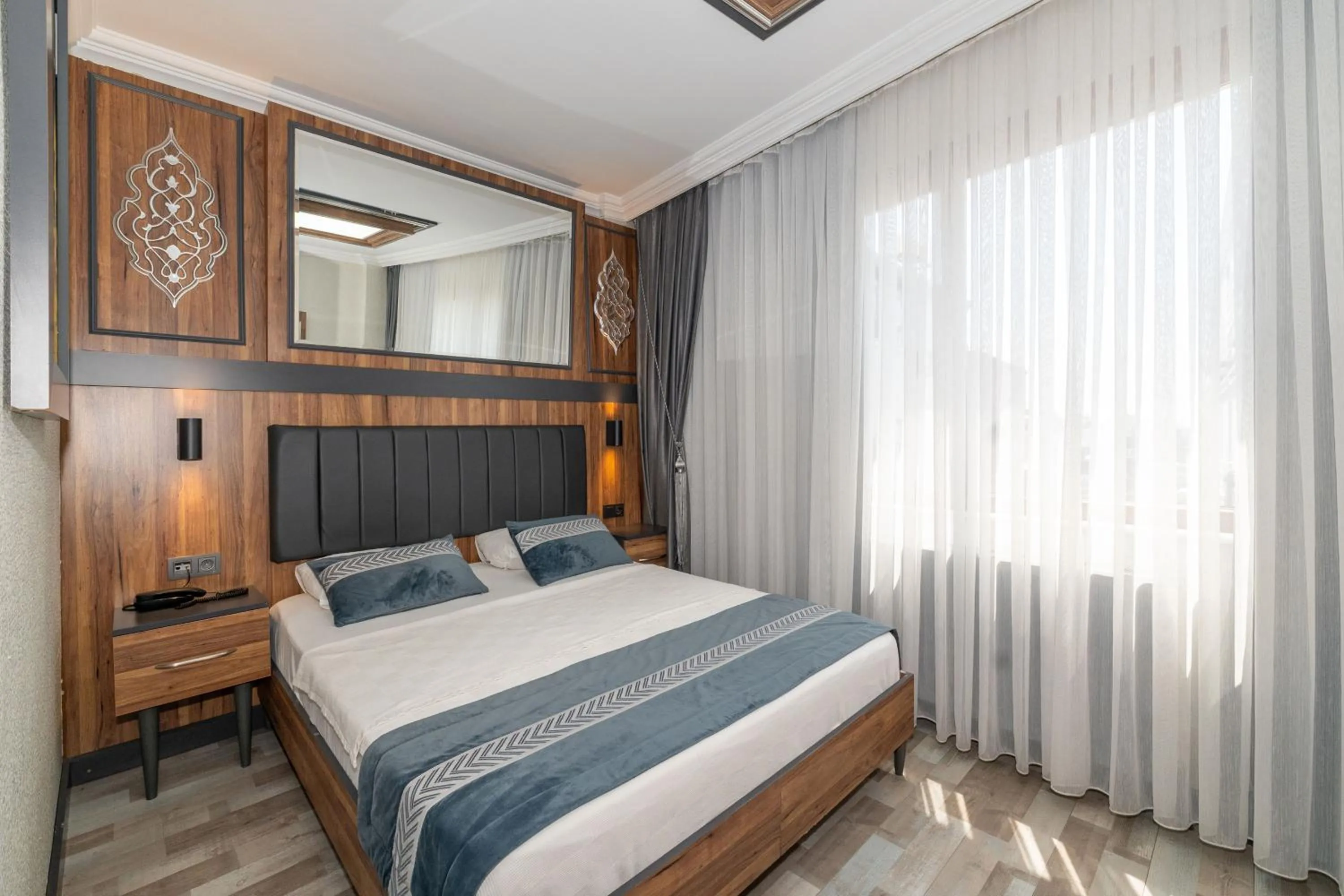 Bed in La Serena Taxim Hotel