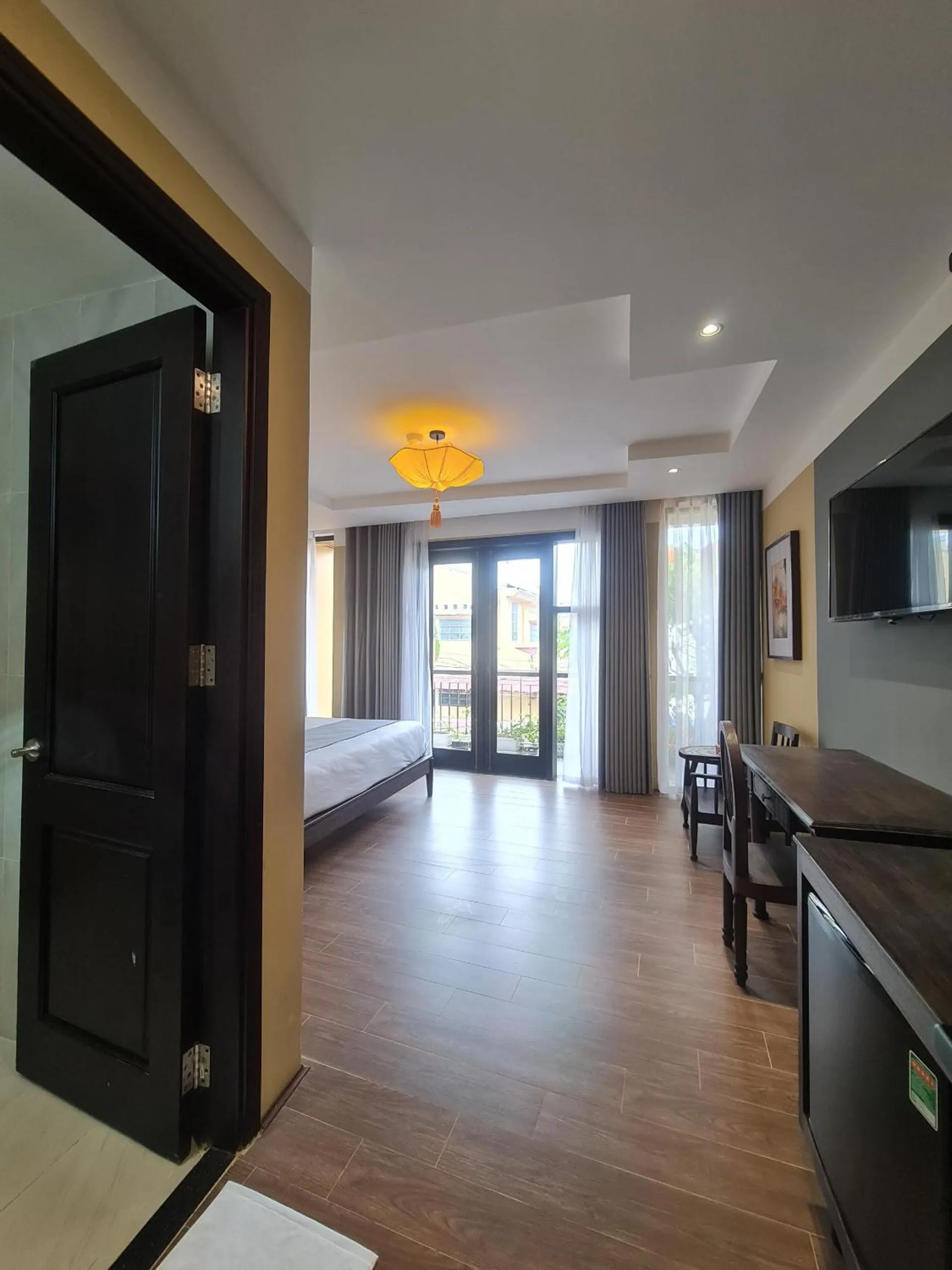 Communal lounge/ TV room, Bed in Hoianan Boutique Hotel