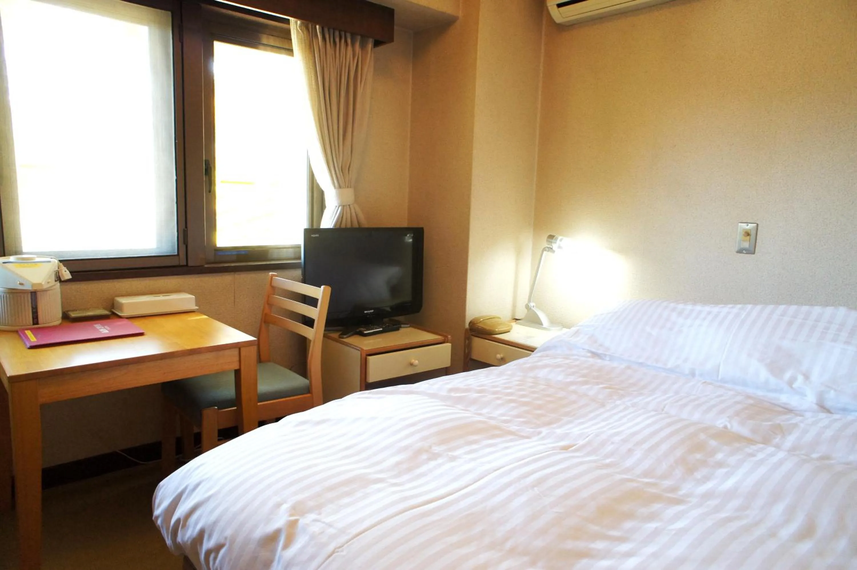 Bed in Petit Hotel Shitaka