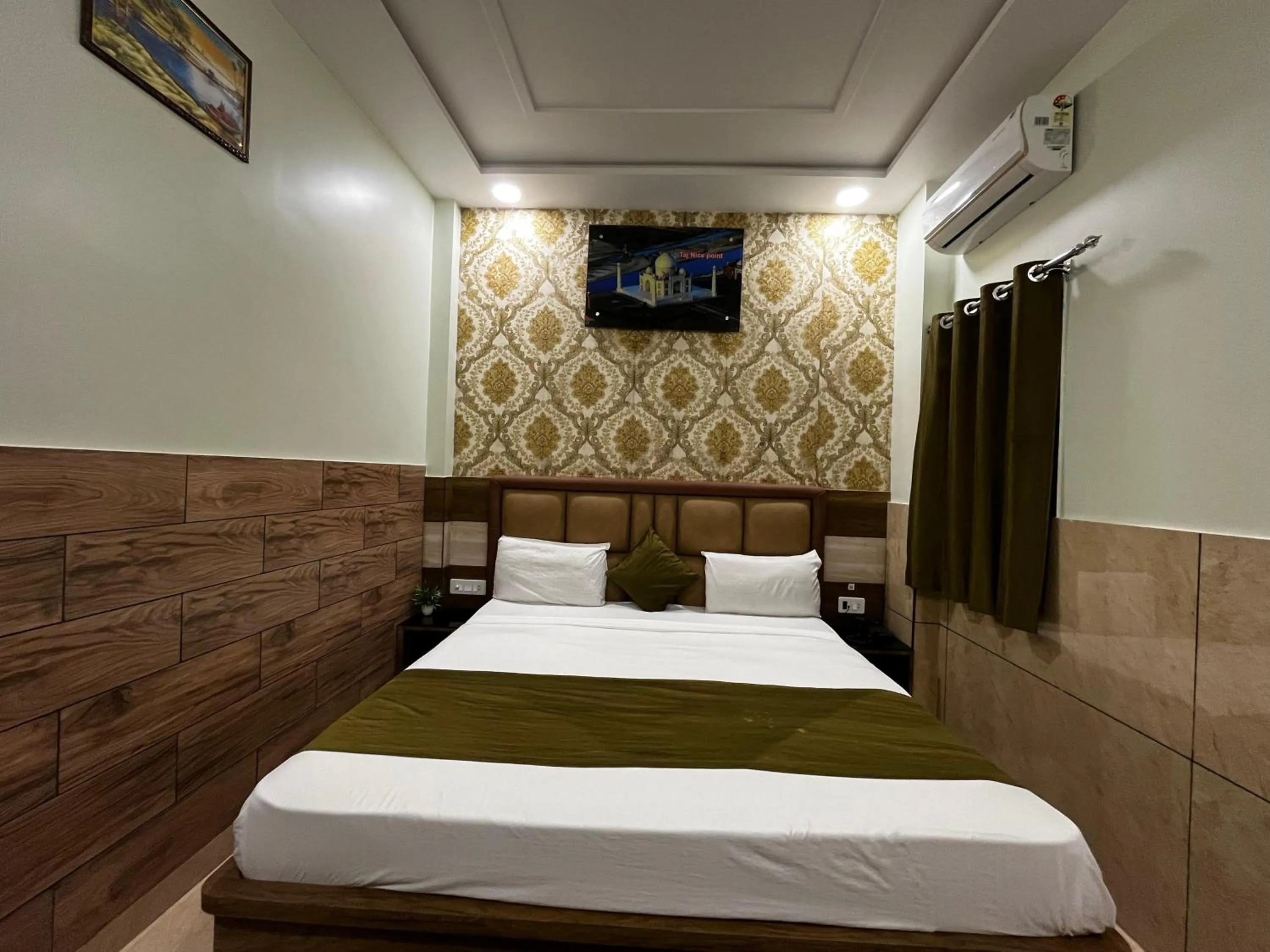 Photo of the whole room, Bed in Taj Nice Point Manage by Taj Sunrise Group