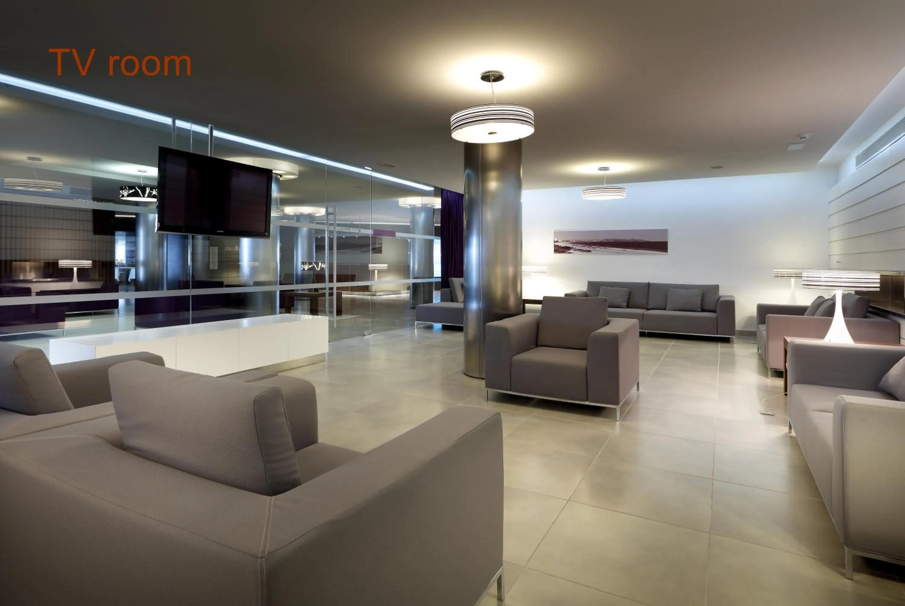 Communal lounge/ TV room in Hotel Garbi Ibiza & Spa