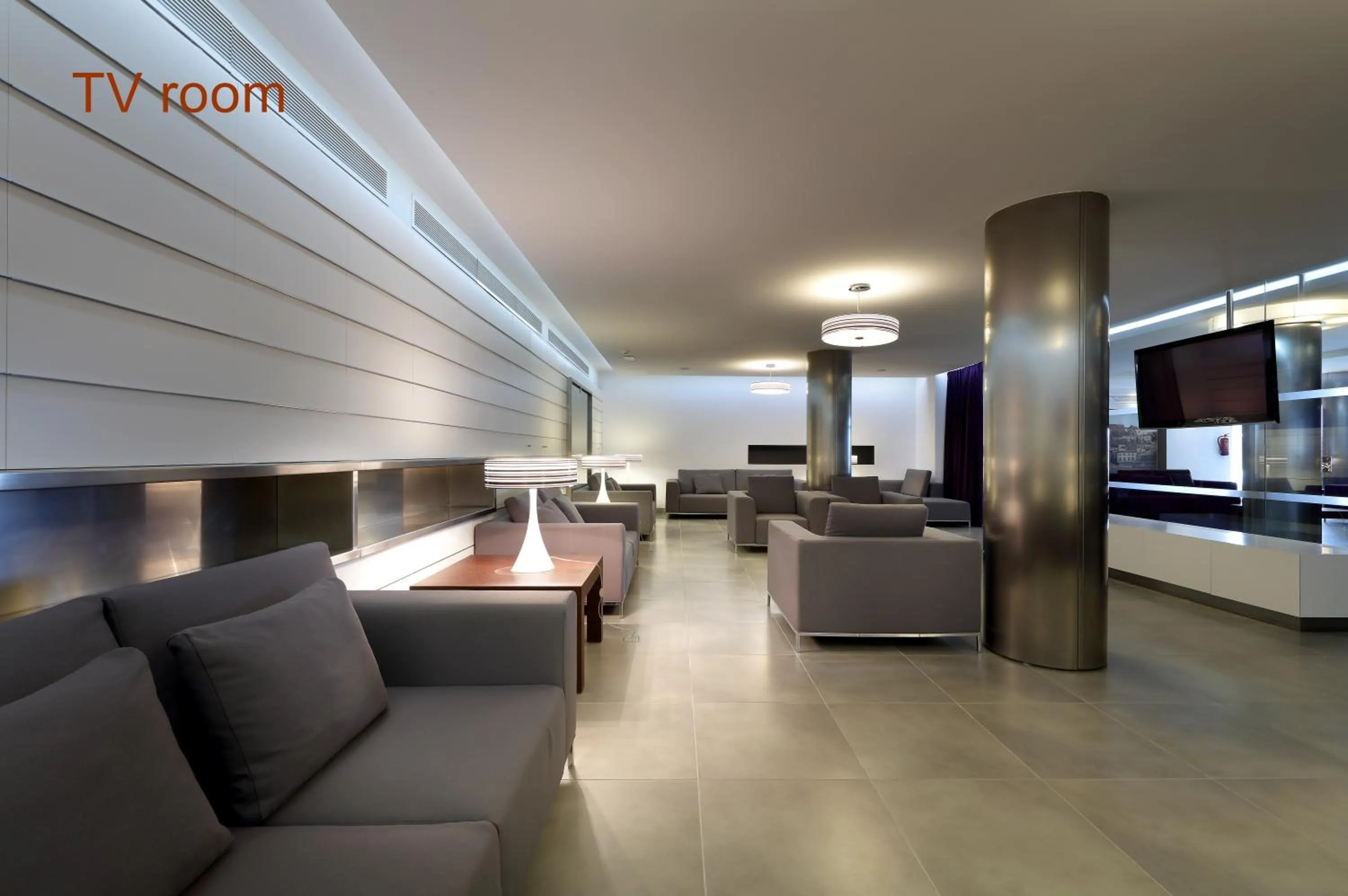 Communal lounge/ TV room in Hotel Garbi Ibiza & Spa