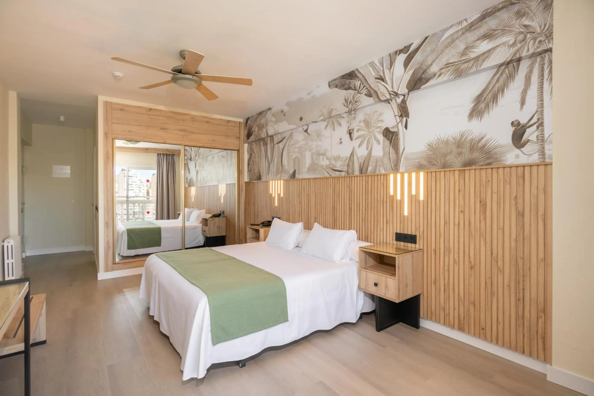 Bed in Hotel Parasol by Dorobe