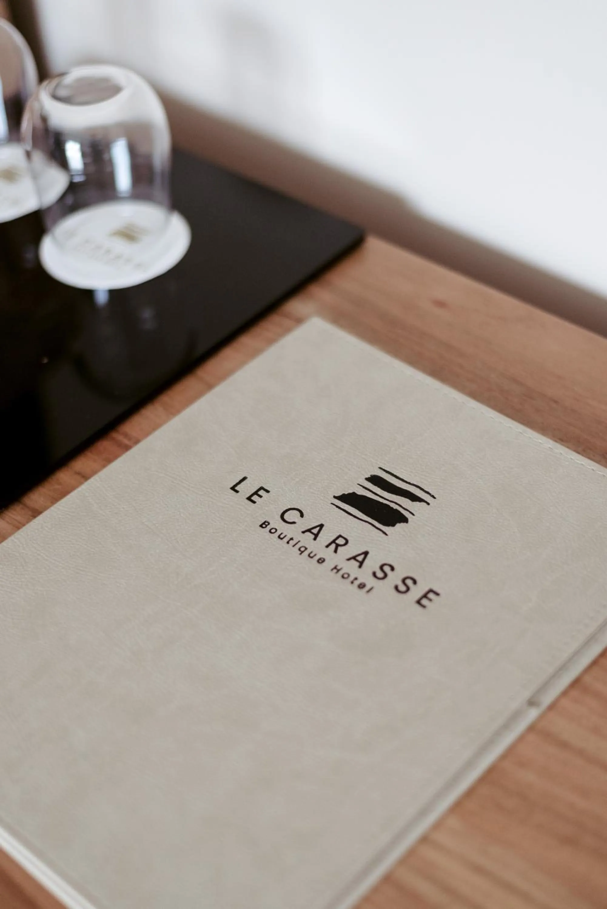 Property logo or sign in Le Carasse Boutique Hotel